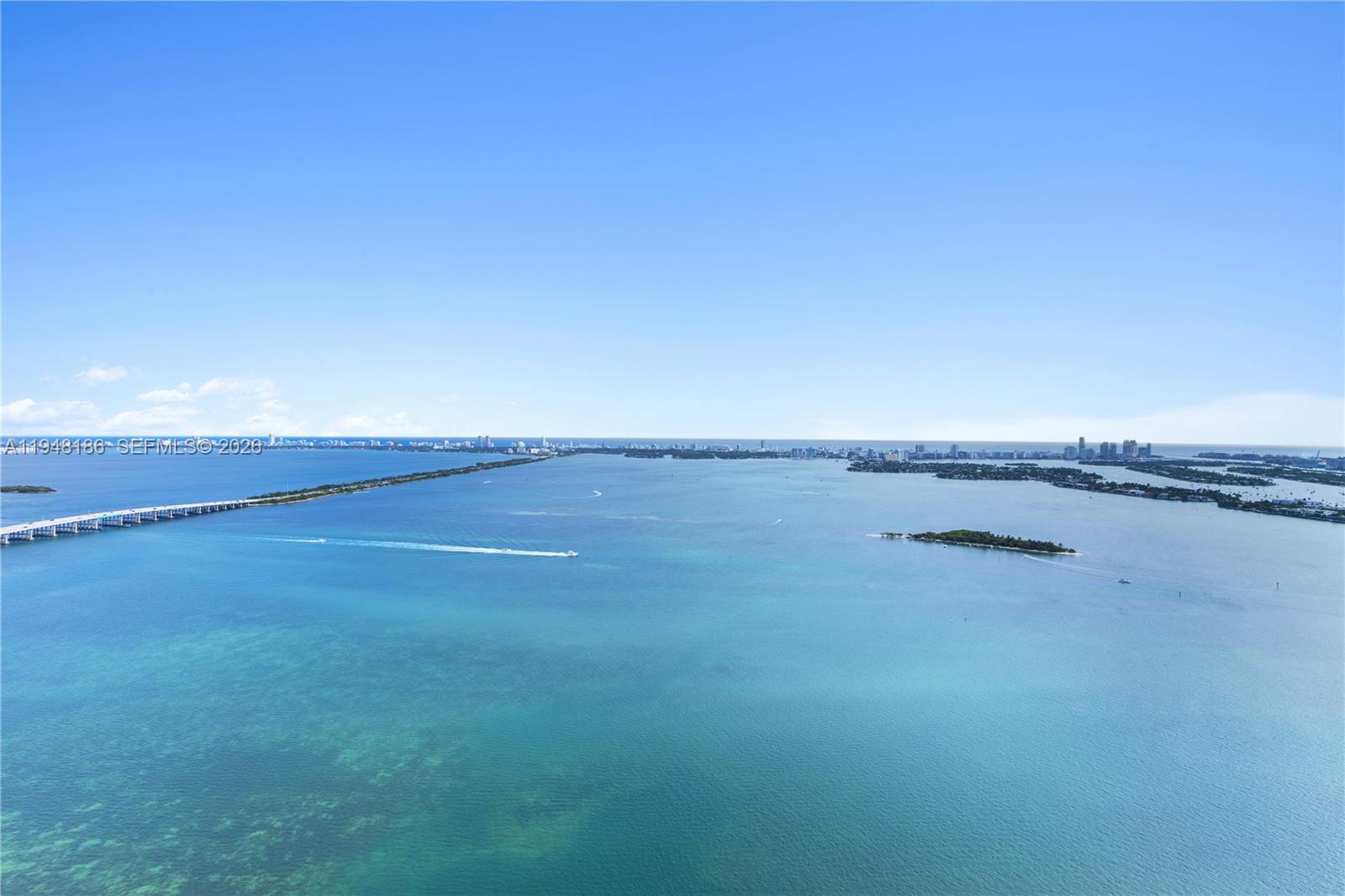 Perched on the 47th floor, elegantly finished Edgewater residence captures uninterrupted panoramas of Biscayne Bay and the Atlantic, offering a true sense of elevation and escape above the city. Spanning 2,586 SF, the 3BD/4.5BA layout is thoughtfully designed with floor-to-ceiling glass, expansive living and entertaining spaces, and seamless natural light throughout. Each bedroom is ensuite, anchored by a serene primary suite with a focus on privacy and comfort. A boutique-style building with resort-level amenities, including sunrise and sunset pools, tennis, fitness, and curated wellness spaces just moments from the Design District, Wynwood, Downtown, and Miami Beach.
