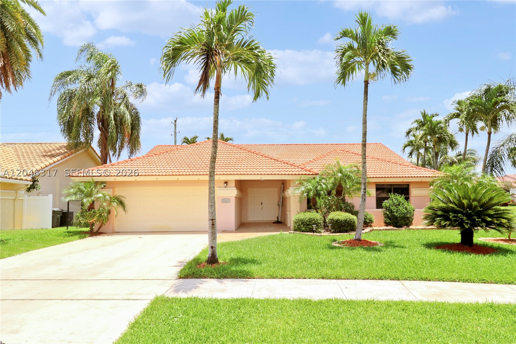 IMMACULATE WATERFRONT RESIDENCE! This meticulously maintained 3-bedroom, 2-bath home boasts soaring vaulted ceilings and an inviting split-bedroom floor plan designed for both comfort and privacy. Elegant tile flooring throughout means no carpet anywhere in the home.
 The garage is equipped with a convenient utility sink and pull-down attic staircase, providing exceptional storage and functionality. Enjoy significant savings with the lake-fed irrigation system, eliminating costly water expenses for lawn maintenance. The home was freshly painted  a charming covered front entryway that enhances its curb appeal.

Relax and unwind while taking in serene waterfront views, with ample backyard space to build the pool of your dreams.

Located in the highly desirable Sun Valley community of Boynton Beach, this neighborhood comprises 513 single-family homes surrounded by 10 picturesque lakes and ponds. Residents enjoy outstanding amenities, including a community swimming pool, tot lot, basketball court, four tennis courts, and a handball court. the HOA includes basic cable and high-speed internet provided by Hotwire Communications, offering exceptional value and convenience.