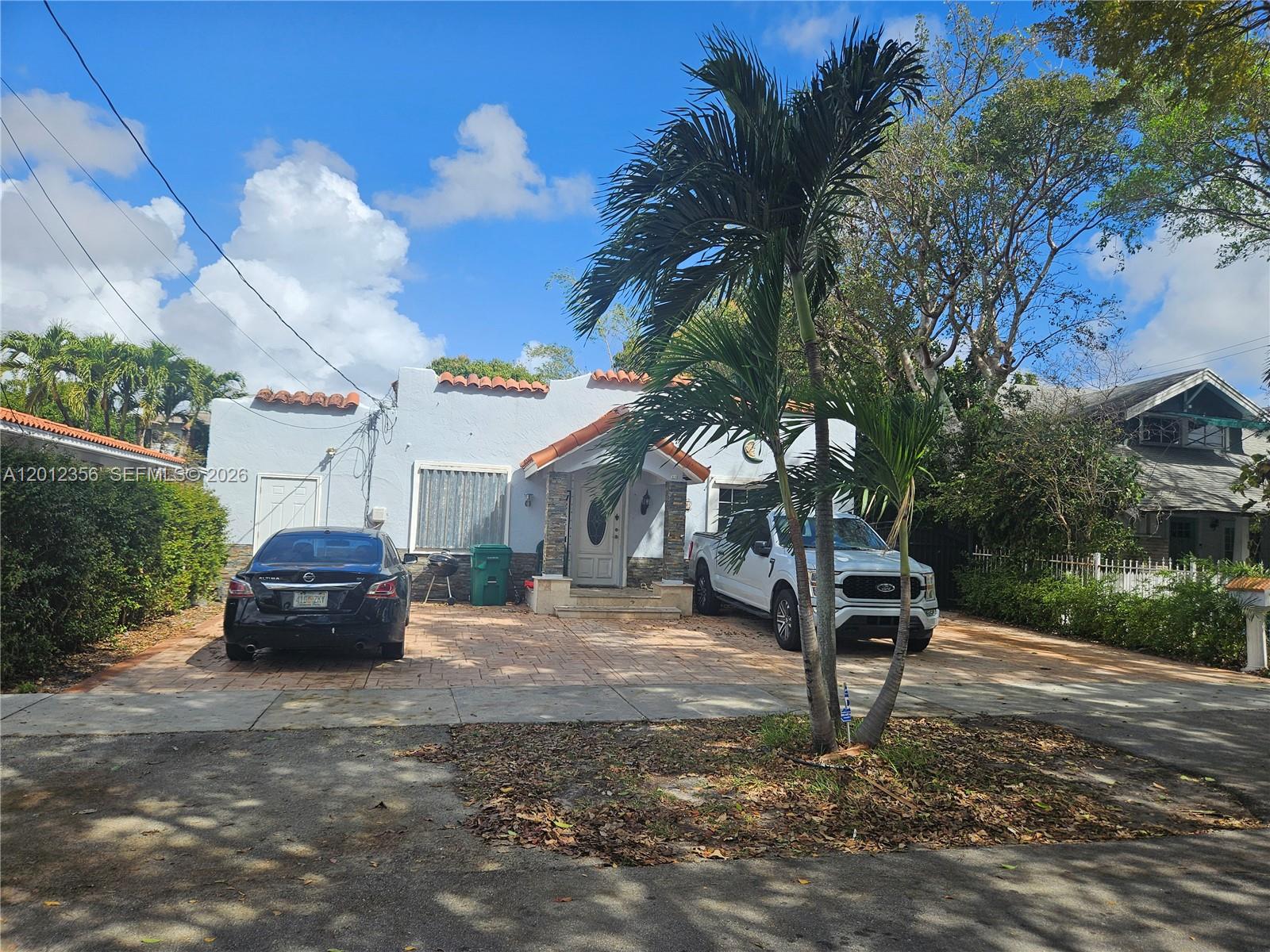 SIGNIFICANT PRICE IMPROVEMENT!! Exceptional income-producing opportunity in the heart of Little Havana. The main residence features 3 bedrooms and 2 bathrooms, along with a flexible additional room that can easily be converted into a separate living area to generate additional rental income or accommodate extended family.
Adding to its strong cash-flow potential, the property includes an attached 1-bedroom, 1-bath efficiency as well as a detached 2-bedroom, 1-bath dwelling unit, creating three distinct living spaces on one parcel. This versatile
single-family property offers multiple revenue streams in one of Miami’s most vibrant and centrally located
neighborhoods. Significant capital improvements provide peace of mind and long-term value, including a roof
replaced with permits in 2024, no cast iron plumbing, and electrical and plumbing systems updated to modern
standards. Both central A/C units are approximately two years old, and the Titan tankless water heater is about
one year old. Hurricane panels are also in place, offering added storm protection for insurance savings. Centrally
located just minutes from Downtown Miami, Airport, Brickell, Miami Beach and all major expressways. This
property presents a rare opportunity for investors or owner-occupants seeking strong rental demand, flexibility,
and solid infrastructure upgrades in Little Havana