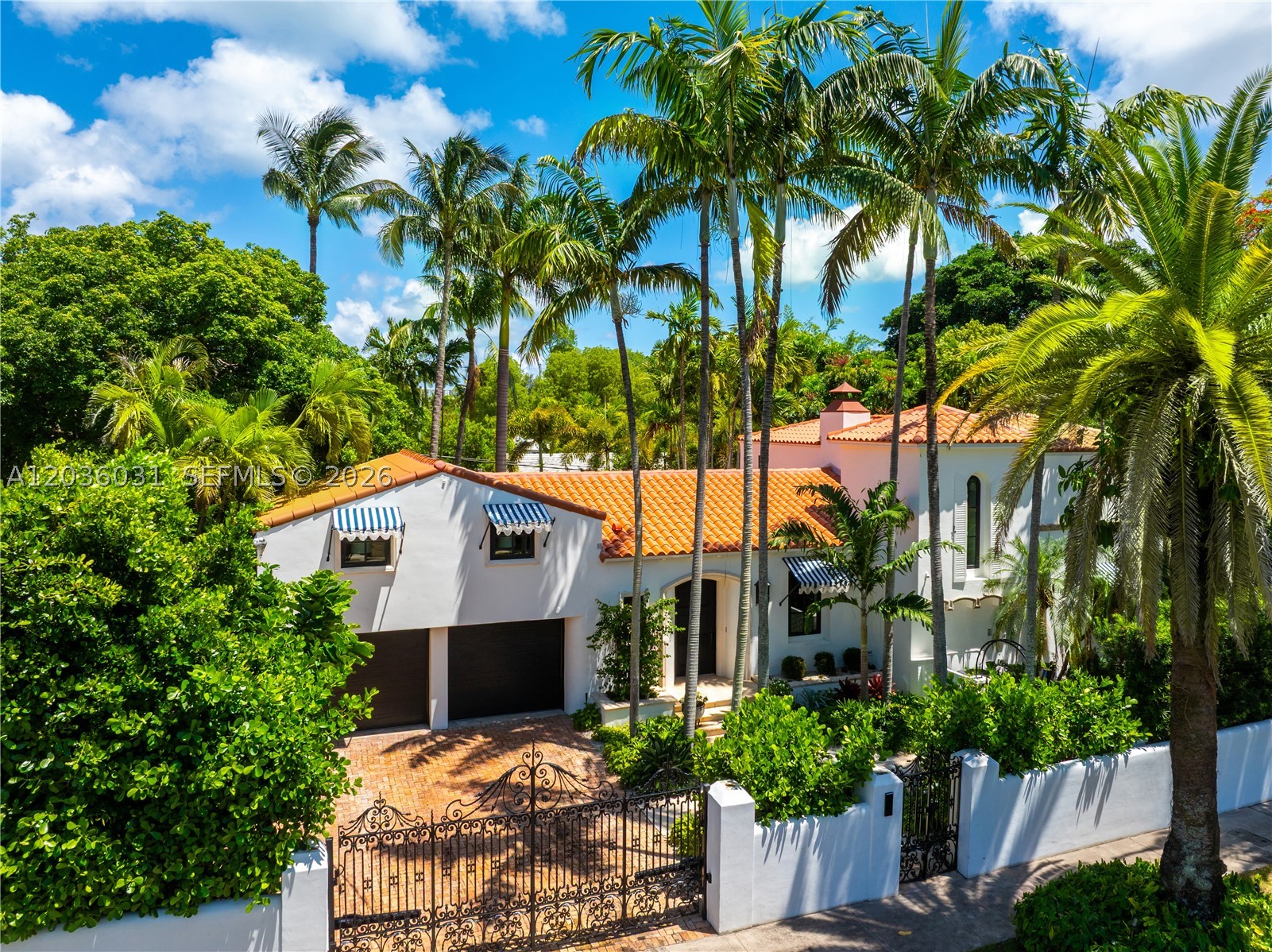 Situated on prestigious North Bay Road—Miami Beach's most coveted residential address—this gated Mediterranean villa offers exceptional privacy, security, and resort-style living. Nestled among the city's most significant waterfront estates, it represents a rare opportunity to own on one of South Florida's most exclusive streets.
Meticulously reimagined by Josh Flagg and Carolwood, and thoughtfully redesigned by BuiltIN Studio and Gary Eisner, the property blends timeless architecture with modern sophistication.
Set on an approximately 10,000-square-foot estate, the roughly 4,000-square-foot residence features 4 bedrooms and 5 bathrooms, designed for effortless indoor-outdoor living. A detached pool pavilion completes the offering with a sauna, cold plunge, powder room, and outdoor shower.
Dramatic vaulted ceilings, wide-plank wood flooring, and an original limestone fireplace anchor the elegant interiors. The white oak kitchen features Sub-Zero appliances, Waterworks fixtures, and bespoke cabinetry. Spa-inspired baths showcase travertine detailing and custom millwork throughout. Custom windows and doors flood the home with natural light, creating a seamless connection to the beautifully landscaped grounds and sparkling pool.
A rare offering on North Bay Road, combining architectural character, luxury finishes, and the ultimate Miami lifestyle on Miami Beach's premier residential boulevard