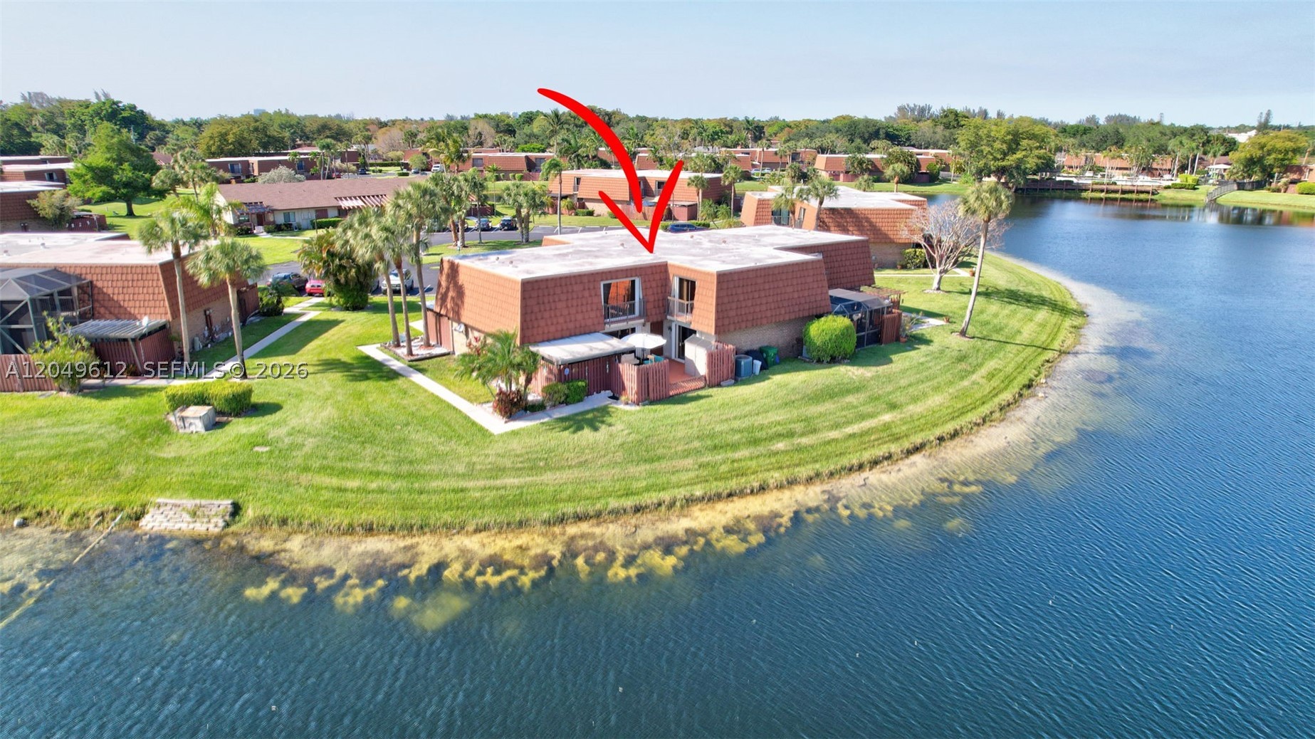 Wake up to water views every day! This rarely available point-lot townhome gives you big lake vibes from almost every rm. With 3BR's, 2.5BA's, & 1,654 sq ft, there’s plenty of space to spread out. The kitchen pops w/white cabinets & granite counters, & the open living area flows right out to your private patio. Upstairs BR's both have balconies w/amazing lake views, including a lrg primary w/dual walk-in closets, & granite in both baths. Accordion shutters for peace of mind. Water Heater/Dishwasher, 1 year old. HOA covers roof repairs. Community pool, basketball, tennis courts, minutes to 595, Whether you're sipping coffee outside or enjoying the breeze upstairs, this home brings the water to you!