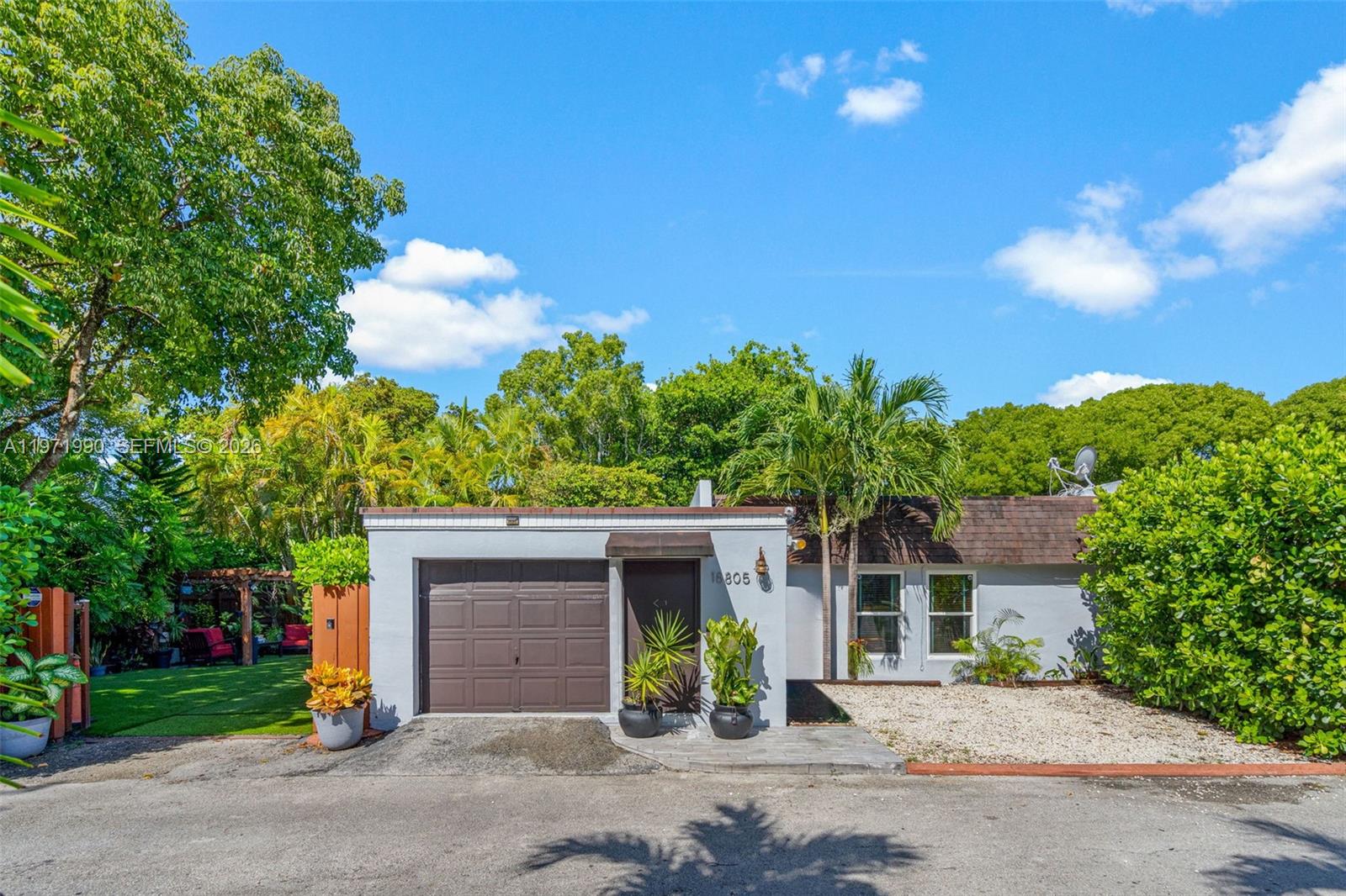 Welcome to your private oasis in the highly sought-after Country Club of Miami! This beautiful corner/oversized lot is equipped with space to park a boat through the side gate and room to build a pool. The backyard is a true retreat, featuring a pergola perfect for entertaining, artificial turf, lush Calusa hedges that offer both beauty and privacy, and screened in patio. This home features tile flooring throughout, an updated kitchen, impact windows for added security, brand-new AC installed last month, a 10-year-old roof, and a 5-year-old water heater. The home also includes a one-car garage, exterior Ring camera system, and is located just minutes from the golf course, YMCA, major highways, shopping, and top-rated schools. Tranquility Meets Functionality