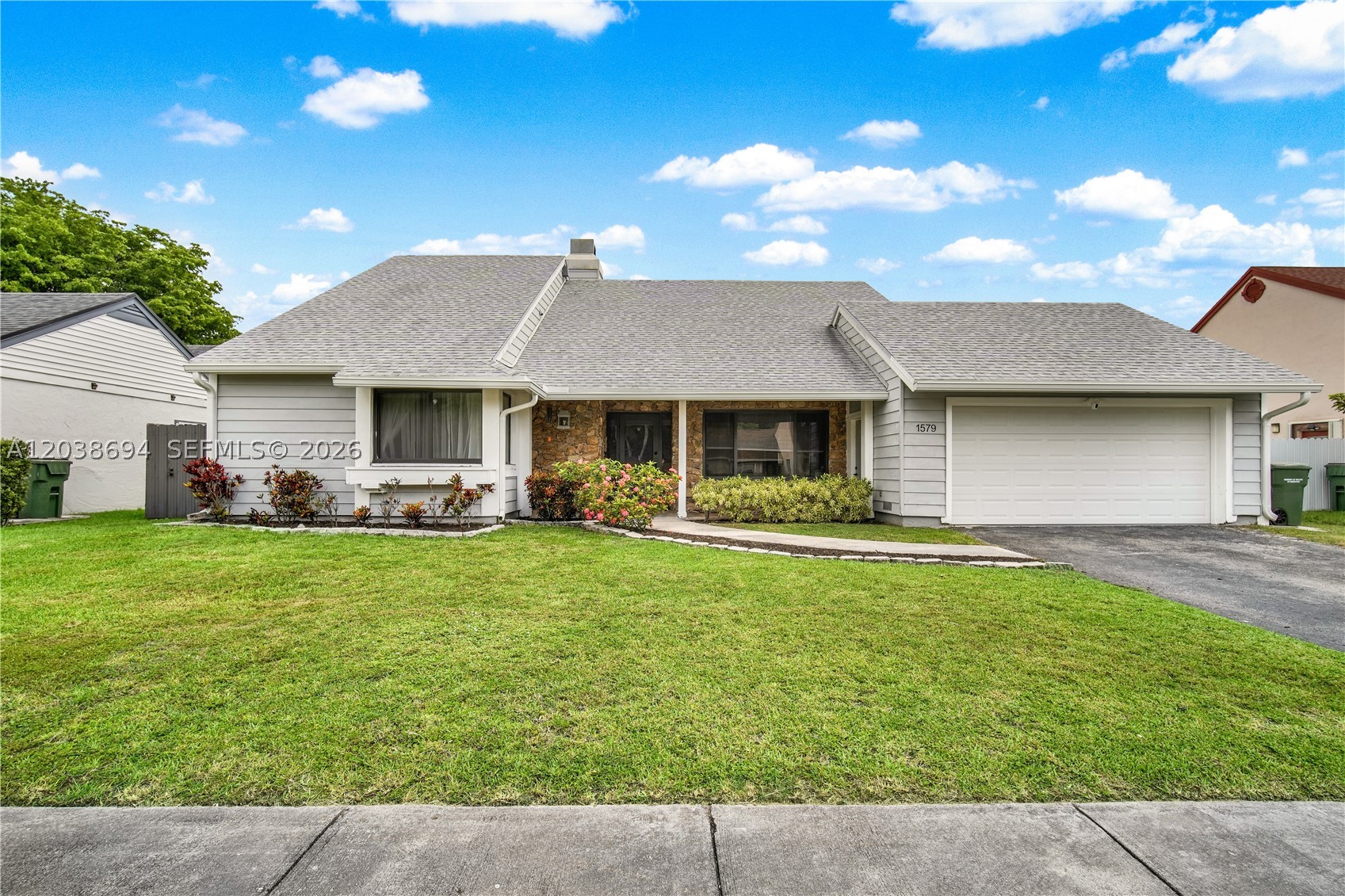 Beautifully remodeled 3-bedroom plus den home located in a desirable Homestead neighborhood. Thoughtfully redesigned with a warm Mid-Century Modern aesthetic, this home offers character, charm, and custom details that set it apart while maintaining a timeless and inviting feel. Unlike many recently renovated homes, this residence was designed with a Mid-Century Modern influence, featuring warm materials, intentional design choices, and a welcoming atmosphere that brings both style and personality to the space. The bright, open-concept layout features a custom kitchen, generous storage, and a functional floor plan offering comfortable living and gathering spaces. Extensive renovations and upgrades were completed between 2024 and 2025, a fully renovated kitchen, impact windows and doors, new flooring throughout the main living areas, recessed lighting, a new A/C condenser, water heater, whole-house water filtration system, EV charger, and remodeled bathrooms featuring new vanities, toilets, updated fixtures, and contemporary finishes. The roof was replaced in 2019, providing additional peace of mind. The home also offers a private den/office, providing flexible space to suit a variety of needs. The spacious primary suite features a custom walk-in closet. Conveniently located near schools, shopping, dining, parks, and major highways, this move-in-ready residence blends timeless design, modern comfort, and thoughtful upgrades in one of Homestead’s most convenient locations.
