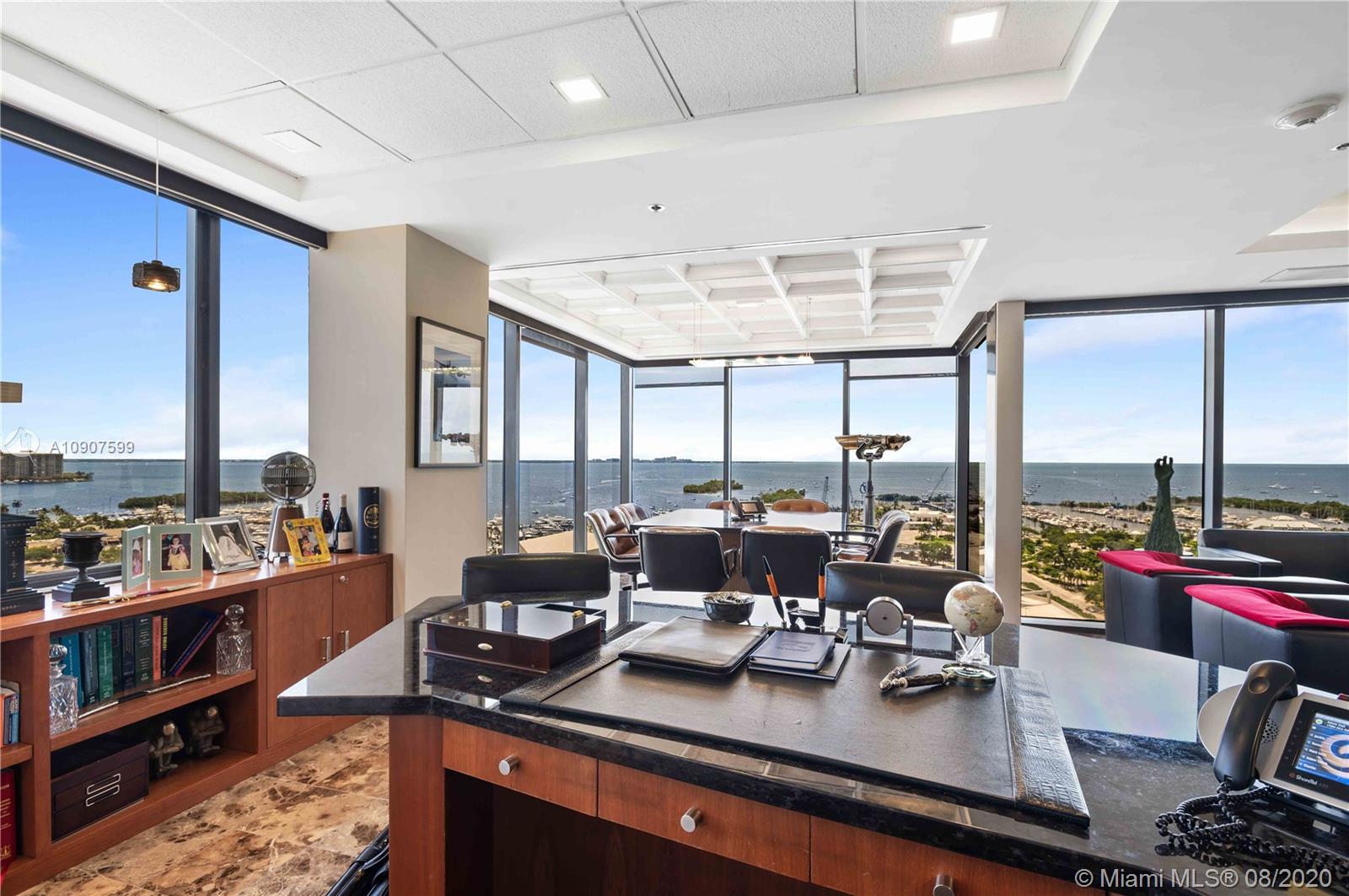 Unique and rarely available waterfront penthouse office suite in the heart of Coconut Grove! Spanning the entire floor at the Grand Bay Plaza on South Bayshore Drive, a highly sought after prestigious landmark ‘Class A’ office building. Spectacular water and city views from every corner of this well-appointed and expansive penthouse. Features include top-of-the-line finishes throughout the elegant private lobby/ reception area, 2 glass enclosed conference rooms, 5 Executive offices, 9 private offices, 12 workstations, a full size Kitchen and a Kitchenette, Equipment Room, Print/Copy/Filing Room, and a secure Storage area. The expansive private terrace, spanning the entire south side of the suite, offers panoramic views of Biscayne Bay, as well as sweeping city views.