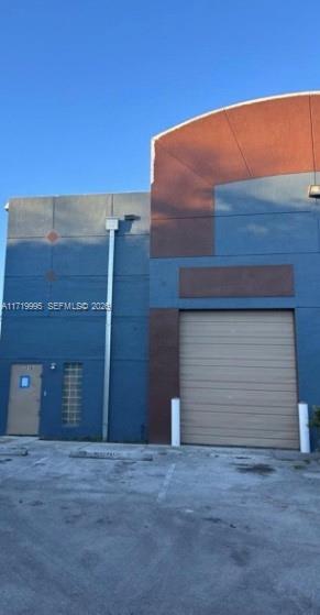This spacious corner unit is strategically positioned in a high-traffic area on US 441/SR 7, just  Perfectly situated for maximum exposure, it offers quick access to major highways including I-95, the Turnpike, and Palmetto 826, with easy routes to Hard Rock Stadium,  Located within a secure industrial park with controlled access,  parking spaces and, storage area, and a mezzanine. With a 20-ft high ceiling, it’s ideal for light manufacturing, assembly, distribution, or other commercial uses such as a printing .  the unit passed a fire inspection and is ready for immediate use. The low HOA fee includes water, and there are no extra assessments due. The floor is fully renovated (Complex is located on waterfront zoned BU2 canal just yards away from the unit )