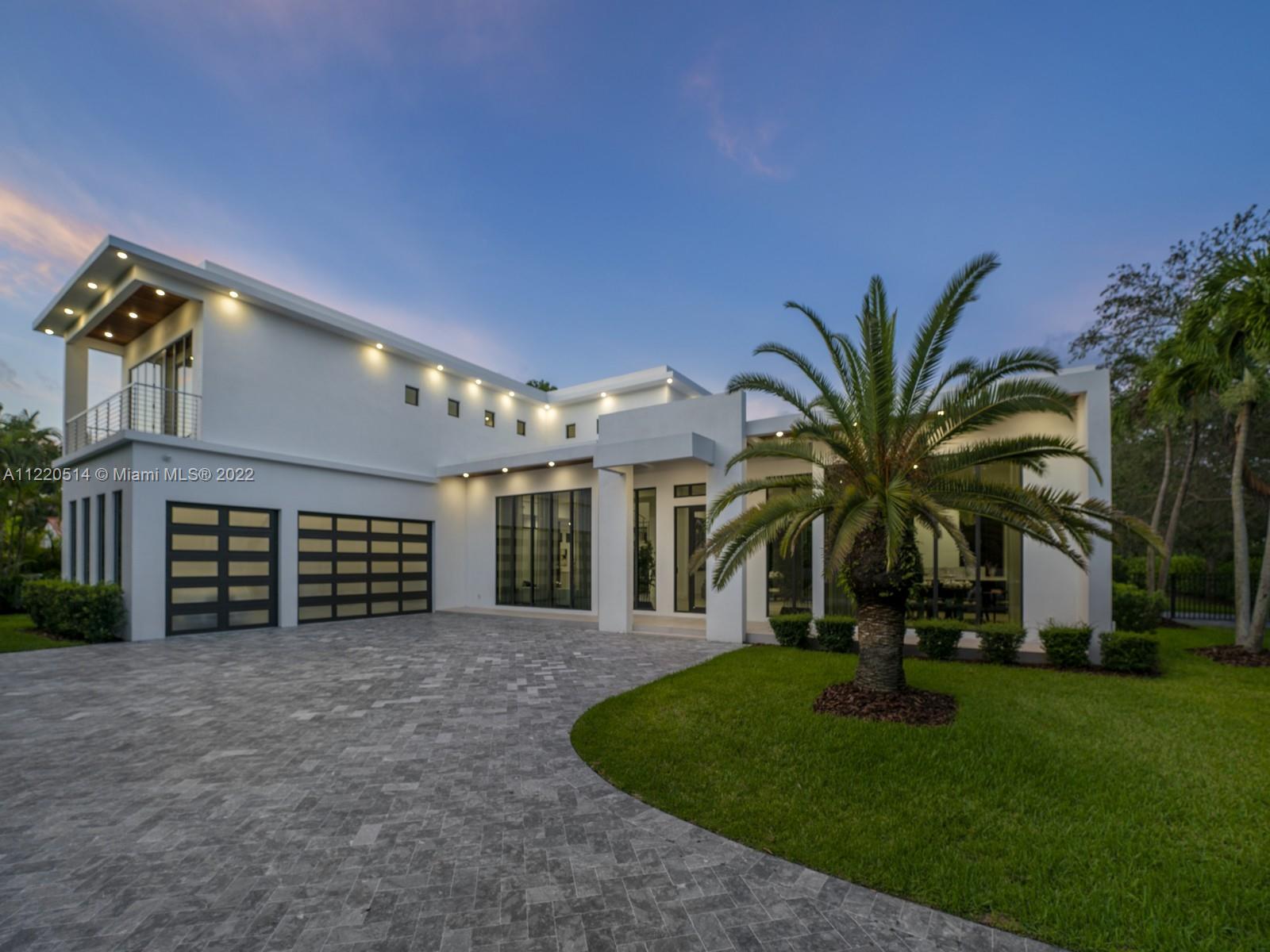Spectacular 2021 two-story modern smart home located in sought after N Pinecrest. This recent build has it all from the minute you enter through the door. Discover a sweeping open flrplan w/ volume ceilings, gorgeous formal living rms, custom built wet-bar & formal dining rm. Enjoy a beautiful gourmet kitchen w/ custom cabinetry, top-of-the-line appl, & oversized gas range, all while overlooking a spacious family room. Take a ride in a home elevator to the second flr where you will find 4 en-suite bedrs including a lavish master suite w/ decorative fireplace & spa bath. An outdr retreat awaits w/ large covered terrace, fully equipped summer kitchen, swimming pool/spa, & ample yd. Add’l Features: Imp win/drs, laundry rm, 3 car gar, concrete roof, & generator ready.