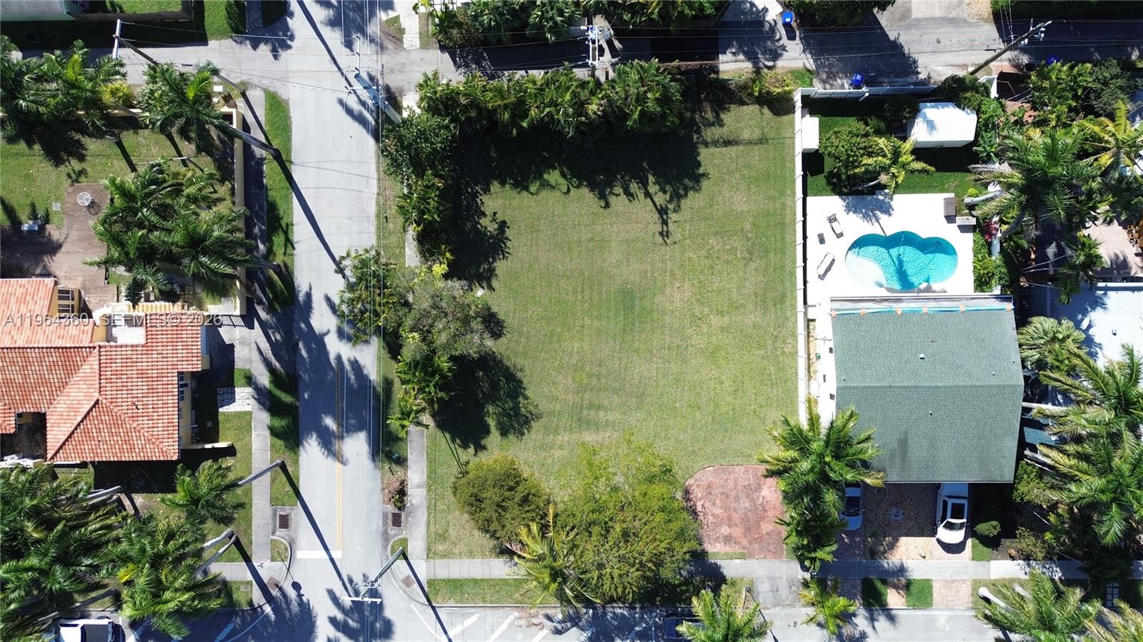 An extraordinary double corner lot in the heart of the prestigious Hollywood Lakes community, offering a rare opportunity to design and build a truly exceptional residence. Properties like this are seldom available in the area, making it a unique chance to create a custom estate in one of Hollywood’s most sought-after neighborhoods.
Ideally located within walking distance to Hollywood Beach, South Lake, and the vibrant downtown Hollywood, you’ll enjoy easy access to fine dining, boutique shops, and entertainment, all while being surrounded by elegant, multimillion-dollar homes.
This expansive lot provides generous space to craft a sophisticated home with room for a resort-style pool, garage, and additional amenities tailored to your vision. Mature palm trees bordering three sides of the property create a sense of privacy and a refined tropical atmosphere.
This is more than a lot—it’s an opportunity to bring your architectural vision to life and build a residence that reflects your lifestyle and aspirations.
