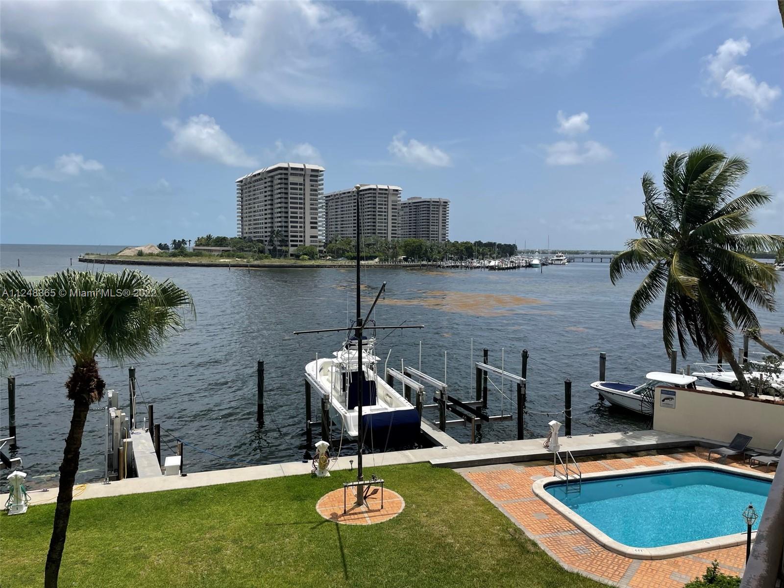 Enjoy direct Bay views from this beautiful 3rd floor, waterfront unit at Pelican Reef in North Coconut Grove. Featuring 2BR/2BA with an expansive covered balcony extending the length of the unit. Large living room and master bedroom have direct views over Biscayne Bay. New kitchen appliances. Wood floors throughout. Two large closets in both bedrooms with built-in shelving. Washer & dryer inside unit. Bathtub in one of the bedrooms. Secure fenced/gated driveway into the property with remote control access. Beautiful lawn in the rear of the property extending to the Bay. Community pool / picnic / BBQ area. One covered parking space with plenty of guest parking. Day Porter on-site to assist with your needs. Quiet neighborhood but still close to parks, Center Grove, Coral Gables & Brickell.