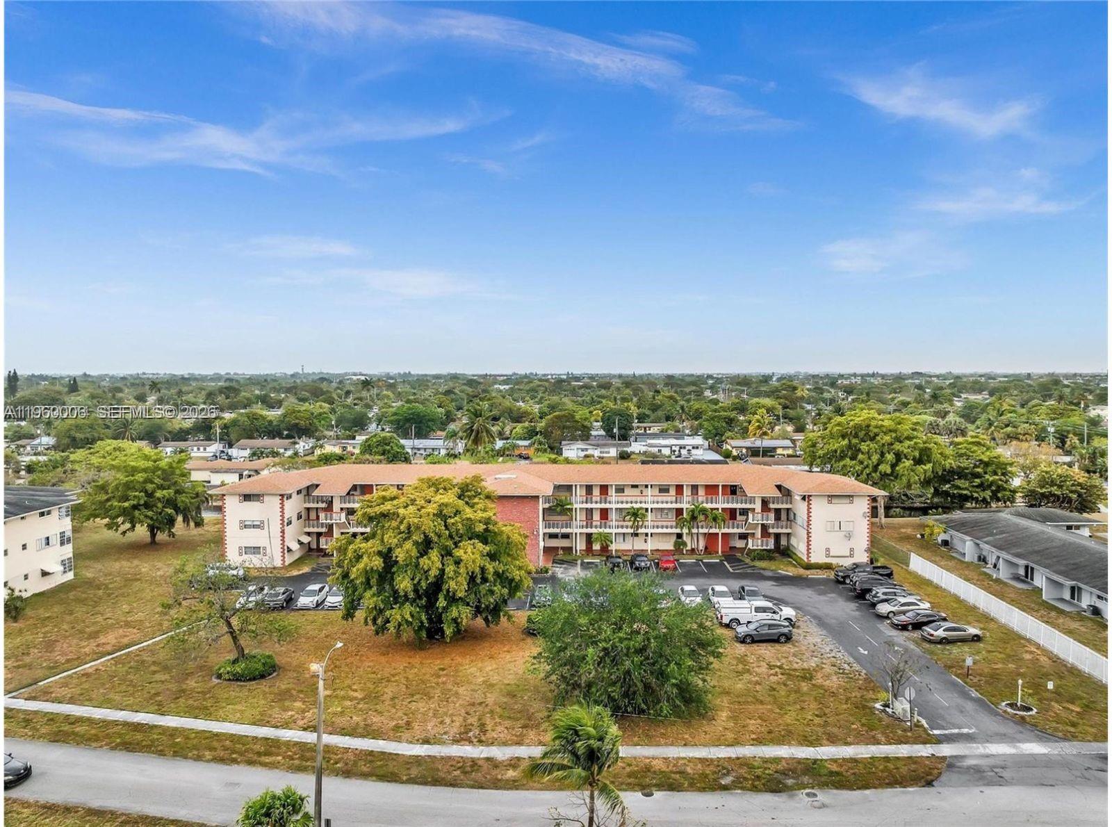 Charming top-floor 2BR/1BA residence located in a peaceful residential community. This well-maintained unit features laminate wood flooring, a modern kitchen with wood cabinetry and stainless steel appliances, a spacious walk-in closet, and a serene canal view from the screened balcony. Assigned and guest parking included. Tenant-occupied. Move-in ready with room to personalize. Motivated seller!