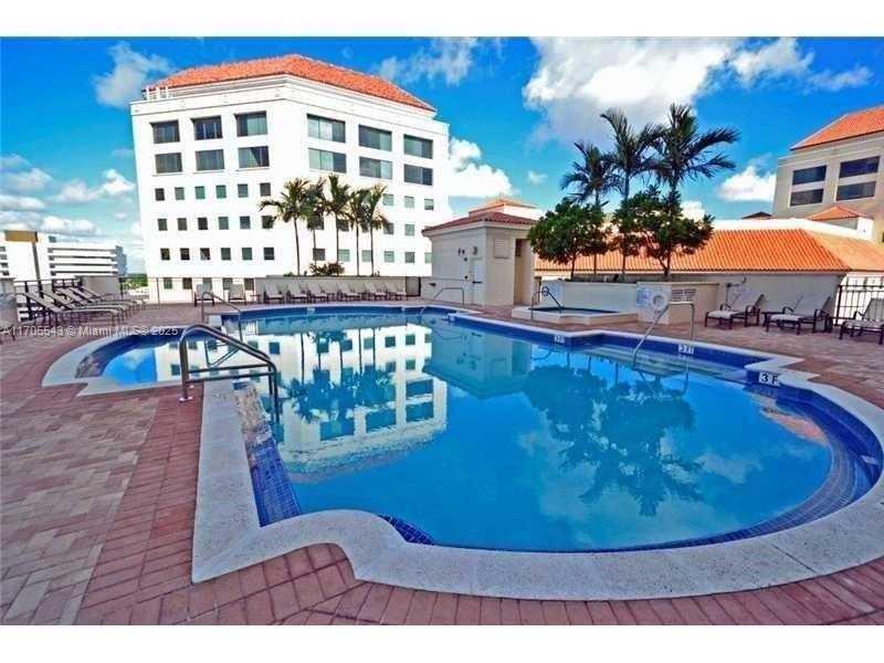 2 parking spaces, Large bright high up unit facing north east with modern stainless kitchen and two parking spots plus guest parking. 2/2 split floor plan condo with ready to move in. Totally tiles, clean and bright,  granite countertops stainless appliances and W/D in unit. HOA includes internet, basic cable, 2 parking space, 24/7 concierge, on-site management. Complimentary valet parking for guests. Heated pool, lovely high ceiling entrance hall, gym and high up recreation lounges, perfect for the evening viewing of the sunset, with mini putting area and all. See pictures.