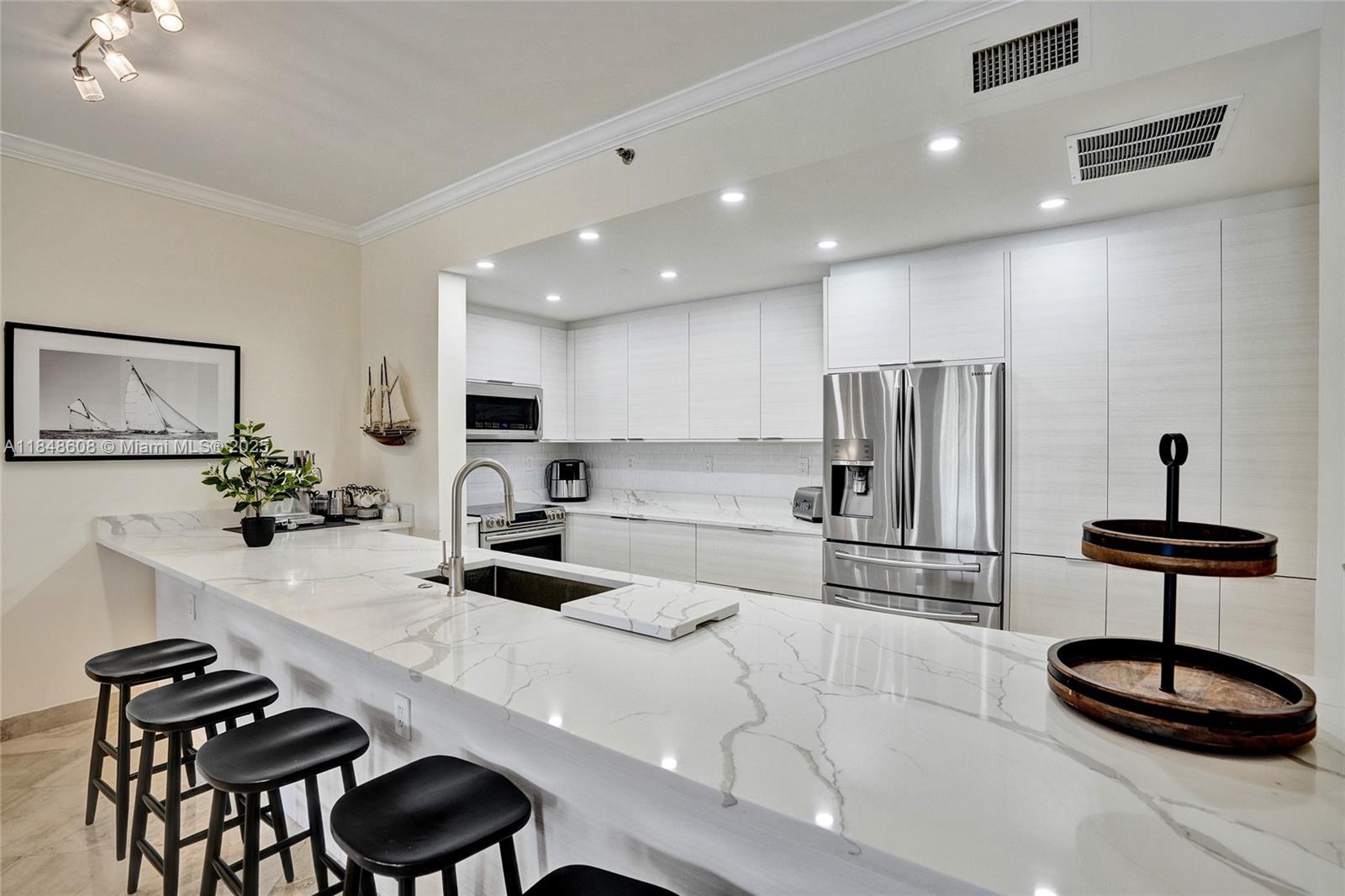 Experience the best of both worlds at spectacular Williams Island. This fully remodeled 3BD/2BA residence feels like a private home with all the elegance of luxury condo living. Enjoy breathtaking pool and marina views, marble floors, a custom kitchen with high-end appliances, and spa-inspired bathrooms. The resort-style community offers 15 tennis courts, 4 pickleball courts, a full-service spa, marina, 4 restaurants, Starbucks, a dog park, walking trails, synagogue, and a courtesy bus. The unit includes generous storage and one parking space with valet or self-park options. Special assessment will be paid in full by the seller. Discover unmatched comfort and convenience.