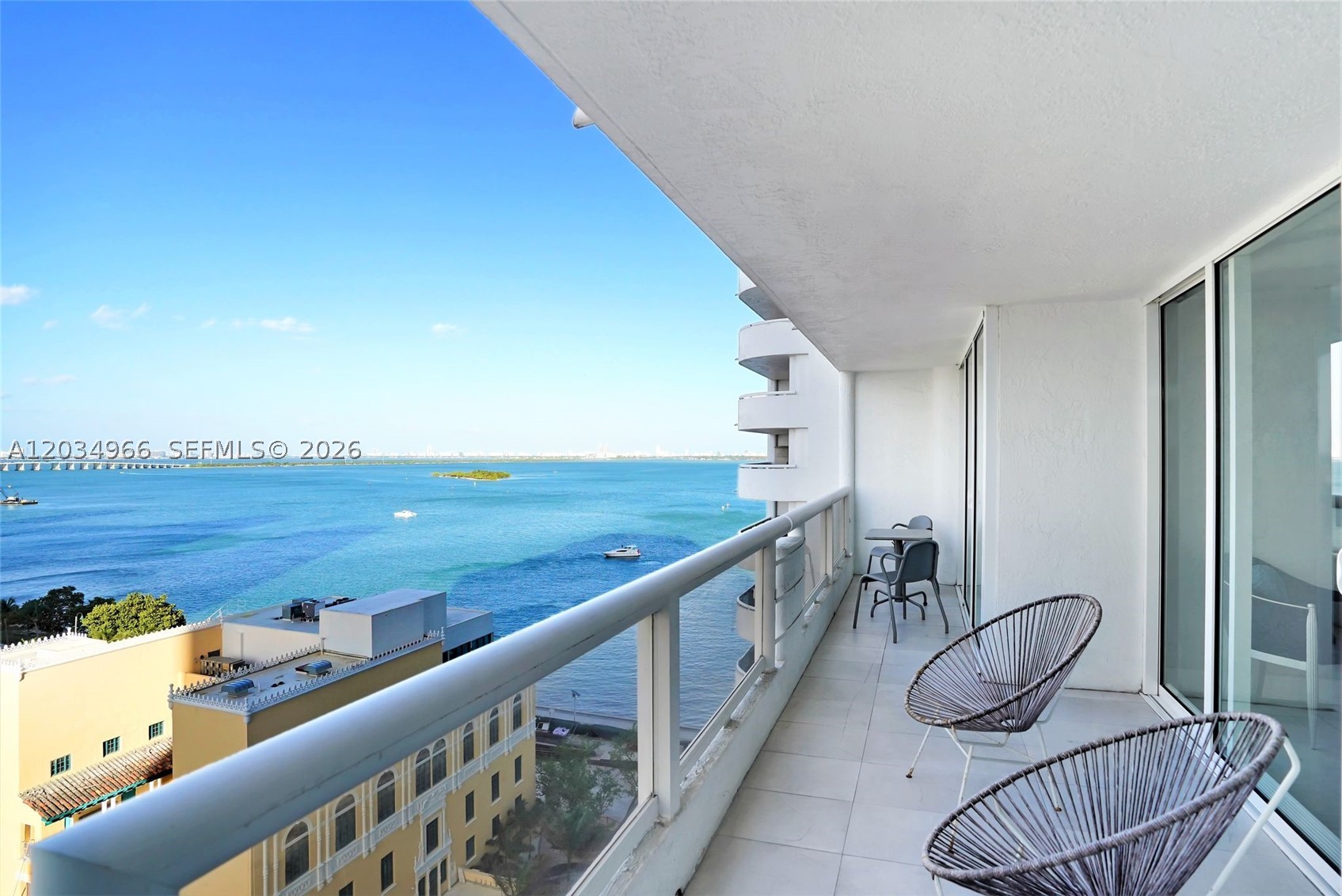Breathtaking bay views from the 17th floor! Welcome to Unit A-1740 at The Grand Condominium, a sprawling 2-bedroom, 2-bathroom residence boasting 1,390 square feet of beautifully optimized living space. This bright, open-concept condo features an updated kitchen, tile flooring, and an in-unit washer/dryer. Slide open the glass doors to find an incredible balcony stretching the entire length of the condo—accessible from the living area and both bedrooms—perfect for watching yachts pass by on Biscayne Bay. The primary suite includes a walk-in closet and a deluxe bathroom with a bidet and a separate tub/shower combo. Live a full-service resort lifestyle with premium dining, a gym, a massive pool deck, a pharmacy, and a private marina right downstairs.