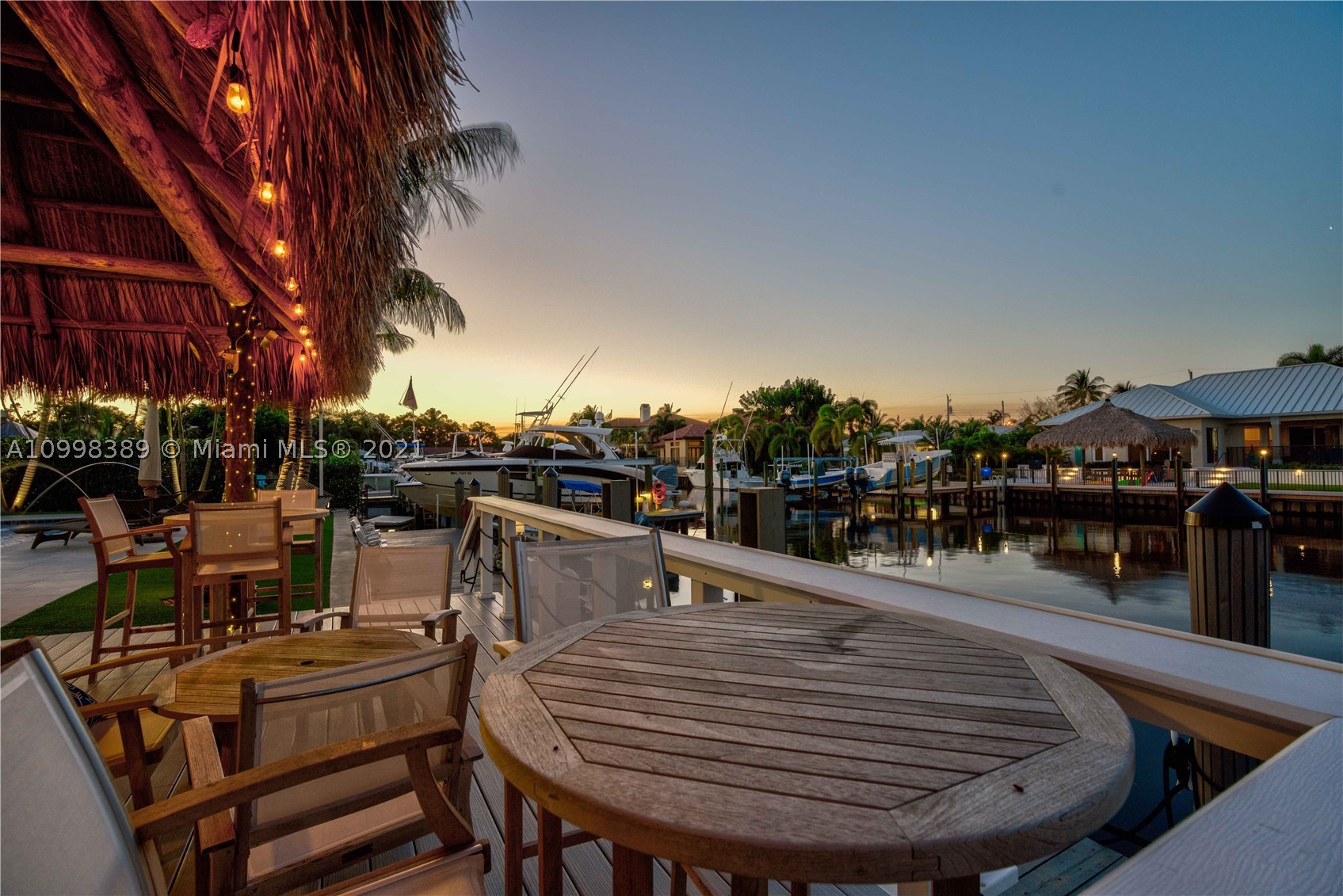Rarely available! Stunning single story CBS modern estate home on 100’ of waterfront.  One of the best "NO HOA" streets in PBG, with wide, deep water canal.  No fixed bridges and easy ocean access via Jupiter and Lake Worth inlets.  This newer premier estate home has 5 bedroom, 5.1 bath plus office, 3 car garage, impact glass and all the amenities of the South Florida waterfront lifestyle.  

Plenty of parking in this brick pavered, horse shoe driveway.  Walk through this Mahogany door into a spectacular foyer with wood tray ceiling and salt water fish tank.  Open floor plan boosts kitchen with large island, living room and den.  Master bedroom plus 3 additional en suite bedrooms plus office in the main house and separate 1/1 guest house.  One room currently being used as a media room.