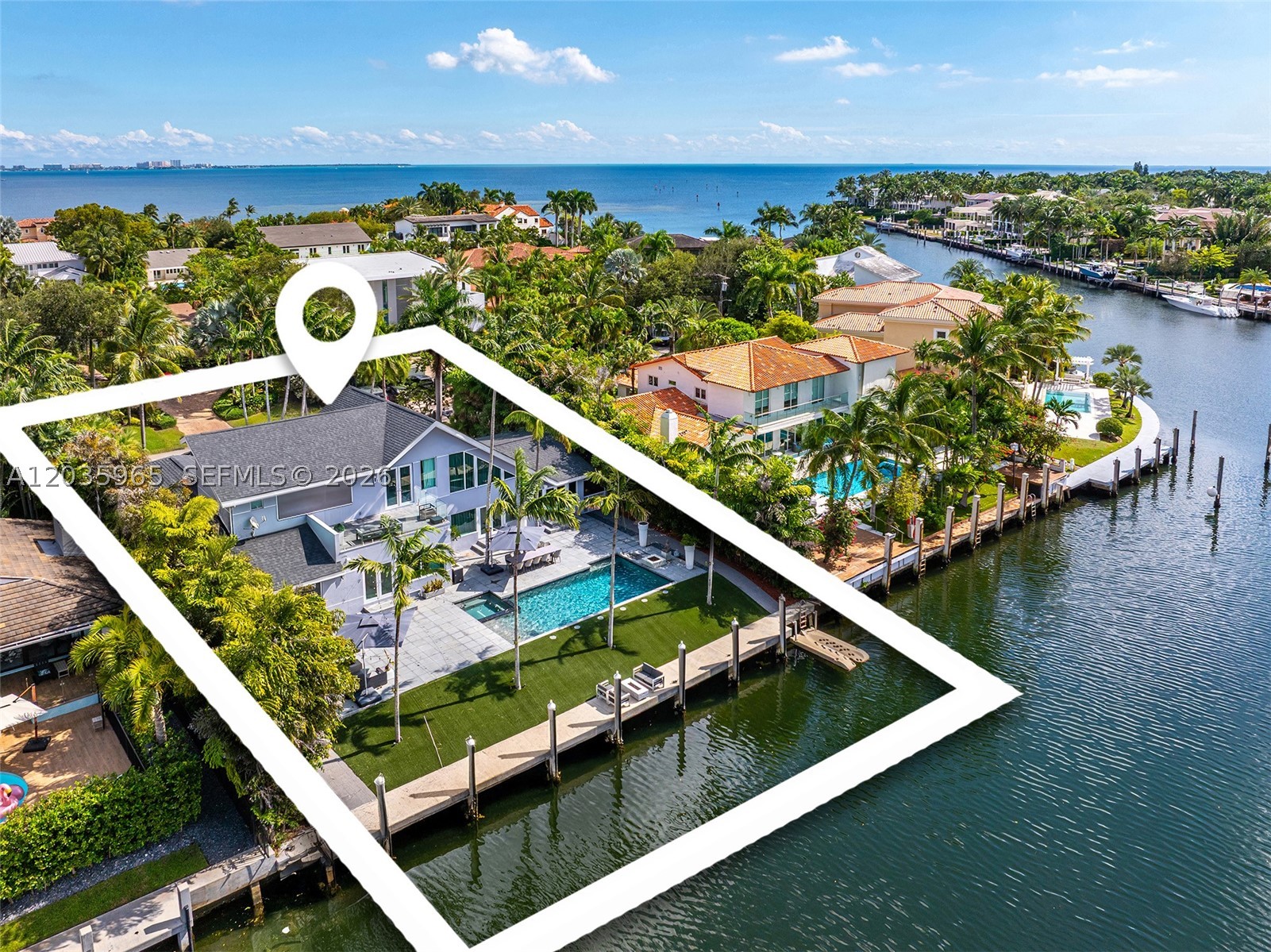 Where Coconut Grove meets the Gables, within the guard-gated waterfront enclave of Sunrise Harbour, this beautifully renovated residence offers the best opportunity inside the luxury yachting community.
Situated on a 14K SF lot with 100FT of waterfront along the Gables Waterway, the home enjoys expansive lagoon and panoramic views of the gables waterway. A concrete dock on a deep canal with direct bay access without bridges makes this an exceptional opportunity. Spanning 4,200 SF,  the designer finished residence features 3 bedrooms en-suite, & has been completely updated with immaculate details  & full smart-home system. The heart of the home is the show stopping onyx backlit bar inspired by Baccarat and the designer kitchen featuring custom lacquer cabinetry by Scavolini & an epicurean appliance suite by Wolf, Sub-Zero, and Miele—perfectly suited for both everyday living and entertaining. Spacious living areas capture beautiful water views that seamlessly connect to the outdoor waterfront. For generations, Sunrise Harbour has remained one of the most sought-after waterfront communities, offering its discerning residents 24HR guard-gated security, deep-water dockage, & an unrivaled location, where you can walk to Cocowalk, Coral Gables, top private schools, and premier dining destinations. Whether enjoyed today as a turnkey waterfront residence or reimagined for the future, this is a rare opportunity to own in one of Coral Gables premier residential waterfront communities.