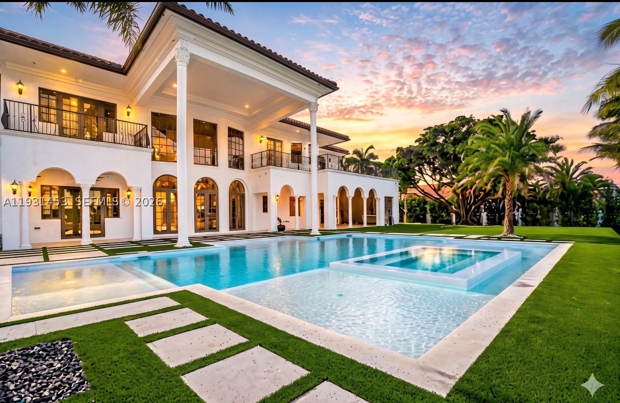 Exclusive lakefront and totally remodeled luxury home at Davie. This magnificent home retreat boasts 9,234 sqft of living area & sits on a 36,850 sqft lot overlooking the water. Double-height ceilings, spectacular chandeliers & mesmerizing water views welcome you as soon as you walk in. Home was fully redesigned & crafted with precision, every detail was hand selected & it shows. Brand new 2025 Roof. On the first level enjoy an exquisite chef's kitchen with double islands, top of the line appliances & a striking cascade hood. Also a separate dining area & bar perfect for gatherings, and a theater room for endless entertainment. LED lighting on walls giving it a modern touch. Beautiful iron cast staircase takes you to the 2nd level or you can use the elevator. The master bedroom is everyone's dream, it's a whole wing of almost 1,000 sqft featuring a bar with sink, separate seating area, French doors leading to the huge balcony overlooking the pool & lake area, and his & hers separate full baths each with its beautiful custom closet. The backyard is a showstopper with a unique pool & jacuzzi, covered area with a summer kitchen, turf and lots green areas for outdoor activities, designed for simple maintenance so you can spend time enjoying it with the most relaxing view. Car lovers will love the 3 car garage, circular paved driveway & separate driveway on the side for extra space. Home feels grand, private & exclusive! Ready to close!