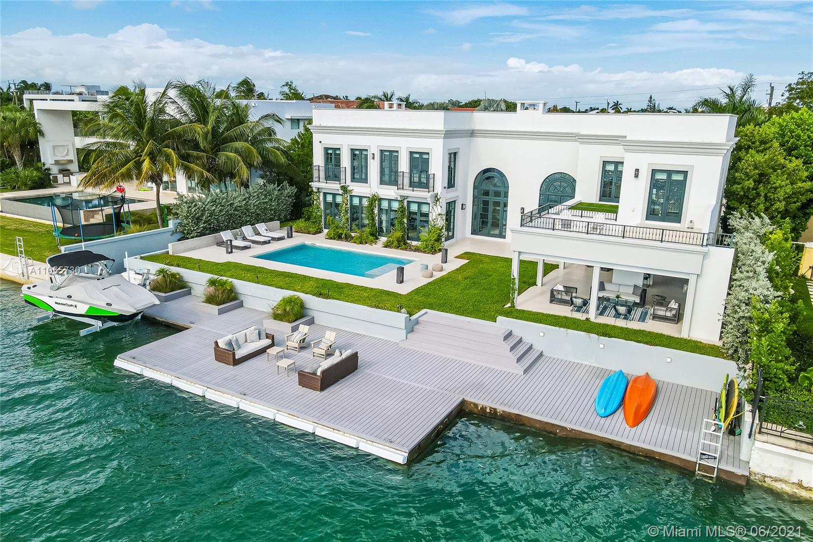 Unique opportunity in the market, newly remodeled house in 2019. Move in just with your toothbrush!!! Exclusive elegant waterfront house with spectacular daily sunset views and exquisite decoration. This beautiful house emulates a French Riviera property with all the modern features: formal dinning, living room, kitchen, office and bedrooms with direct view to the bay, wine cellar, Gaggenau appliances (fridge, steam oven, oven, gas stove), fully equipped gym, Lutron smart technology controls lighting and audio that creates spectacular interior and outdoor settings, elevator, heated swimming pool, generator and impressive private deck with boatlift.