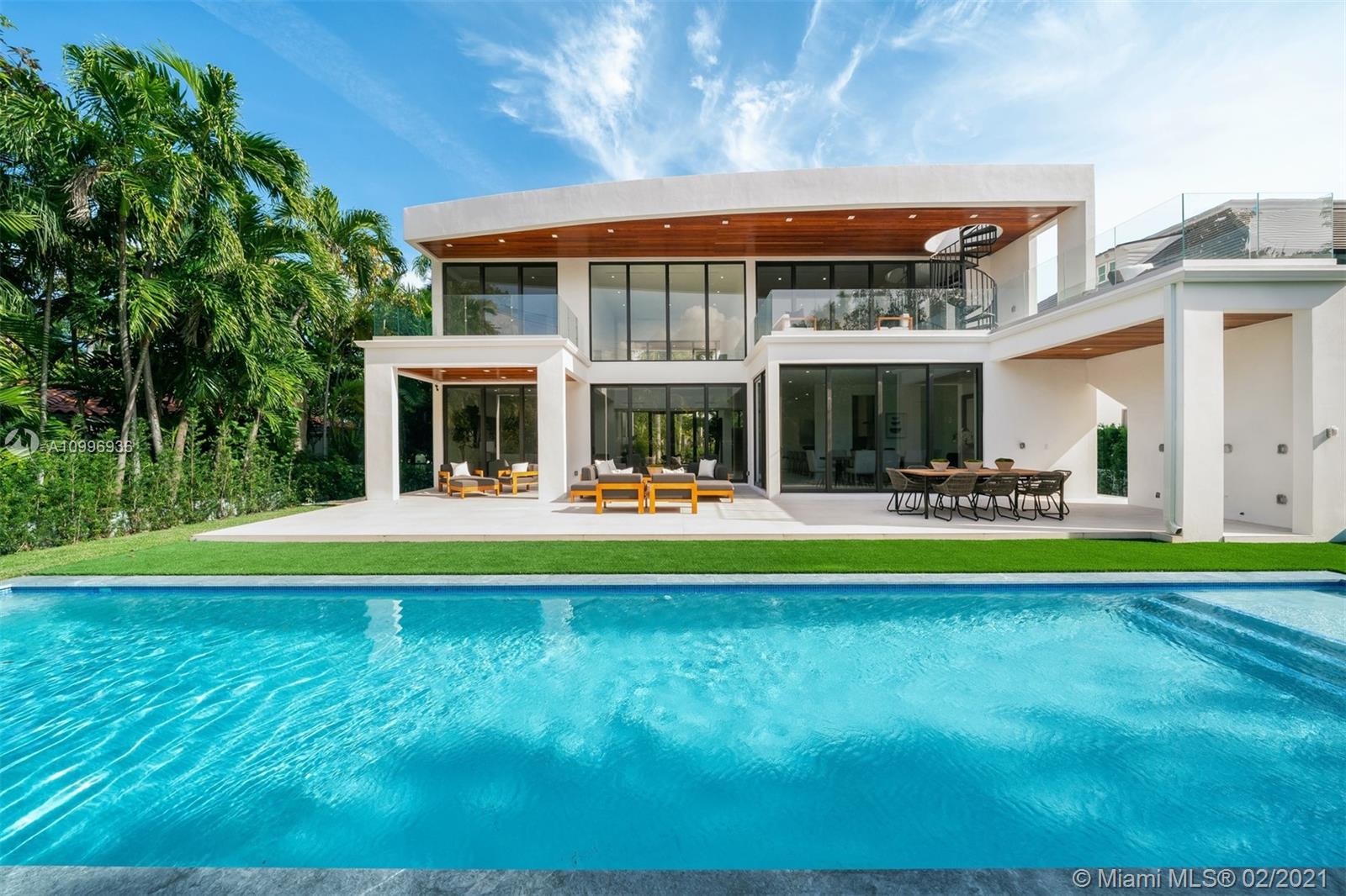 Enjoy being the first to live in this new construction modern oasis, completed in 2021. Located on guard gated Hibiscus Island, this 5BR/5+2BA features direct park views and private 9,750 SF oversized lot. This artfully appointed 4,434 Sf home boasts soaring ceiling heights, open living and chef’s kitchen, top of the line finishes and views of the backyard and sparkling pool throughout. This home epitomizes casual elegance & effortless indoor/outdoor living, w/ glass walls of hurricane impact floor-to-ceiling windows & sliding doors, opening up to a covered outdoor living and dining room. Primary suite w/ large balcony, luxurious bath with soaking tub and oversized shower+ walk-in closet. Multiple balconies & a spiral staircase leading to a rooftop allow for outdoor lounging throughout!