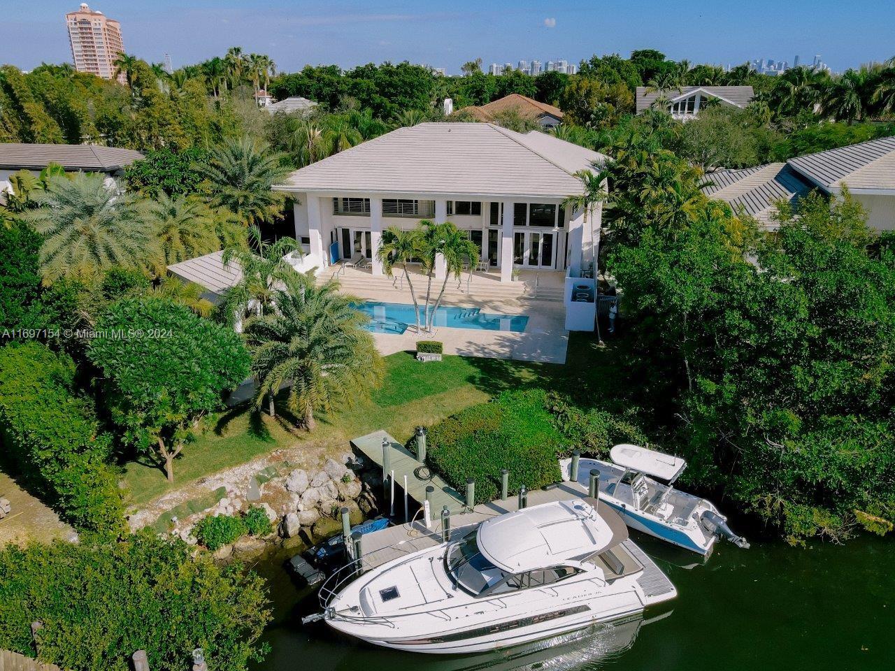 Welcome to 128 Orquidea Avenue, a rare opportunity ready for immediate living or remodeling on a large, premium 0.46-acre cul-de-sac waterfront lot. This property is situated in the heart of Miami’s most prestigious neighborhood, Islands of Cocoplum. Residents enjoy luxury living with unmatched privacy, complemented by 24/7 roaming security patrols. The property features a wonderful covered terrace and cabana, perfect for entertaining. It’s within walking distance of tennis courts, beach volleyball, basketball courts, a heated community pool, gym, clubhouse, and a kids’ playground
