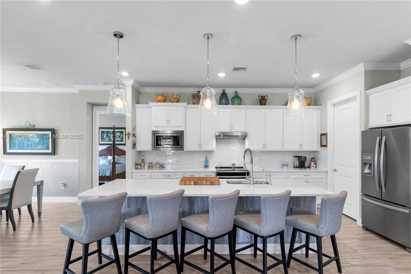 Elegance at its finest! Feels like you’re stepping into a European villa. Move in ready 3 beds & 2 ½ baths + Den. 2 car garage. Screened balcony overlooking serene lake w/fountain. The moment you enter it feels like home. Take your own elevator or stairs up to the main floor. Open concept dining & family room perfect for entertaining. Italian porcelain tile throughout, crown molding, smooth wall texture, designer wallpaper in dining room & baths. Family room has a custom-built accent wall w/ electric fireplace. Beautiful light fixtures & fans. Window treatments on all windows. Storage galore! Laundry room w/ sink & cabinetry. Condo built end of 2018. Community guard gated & has private pool. NO membership required. Updated Boca Lago CC offers social, seasonal & golf memberships. MUST SEE!