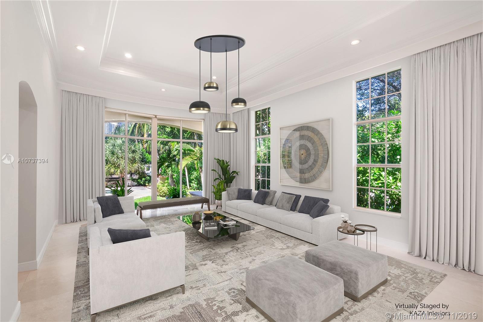 EXCLUSIVE GOLDEN BEACH - SPECTACULAR WATERFRONT ESTATE ON A LARGE CORNER LOT. THIS MEDITERRANEAN GEM IS ELEGANTLY APPOINTED AND BOASTS OVER 7,000 SF OF LIVING AREA WITH VOLUME CEILINGS AND MARBLE & WOOD FLOORS THROUGHOUT. THE MASTER BEDROOM IS OVERSIZE FEATURING LARGE WALK-IN CLOSETS, GYM, NURSERY OR OFFICE, PLUS LARGE TERRACE. A GOURMET KITCHEN FLOWS THROUGH FAMILY & MEDIA ROOM WITH VIEWS OF THE LUSHLY LANDSCAPED POOL/SPA & WATERFRONT. A HUGE FORMAL DINING ROOM AND LIVING ROOM ARE PERFECT FOR ENTERTAINING. SERVICE QUARTERS & PLAYROOM ARE AN ADDED BONUS! SMART TECHNOLOGY, FULL GENERATOR AND IMPACT GLASS THROUGHOUT. GATED COMMUNITY WITH PRIVATE BEACH, TENNIS & BASKETBALL COURTS, CHILD'S PLAY AREA & DOGGIE PARK.