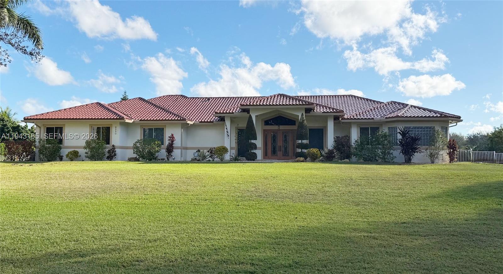 Equestrian community in Southwest Ranches! 2.03 acre property with large stable with 2 stalls, 2 storage rooms that can be easily be reconverted to stalls, and 2 feed/tack rooms. Home features spacious primary and bedrooms, guest/in law suite with full bathroom, office space, walk in pantry, playroom area among many other features. Perfect pool entertaining area.