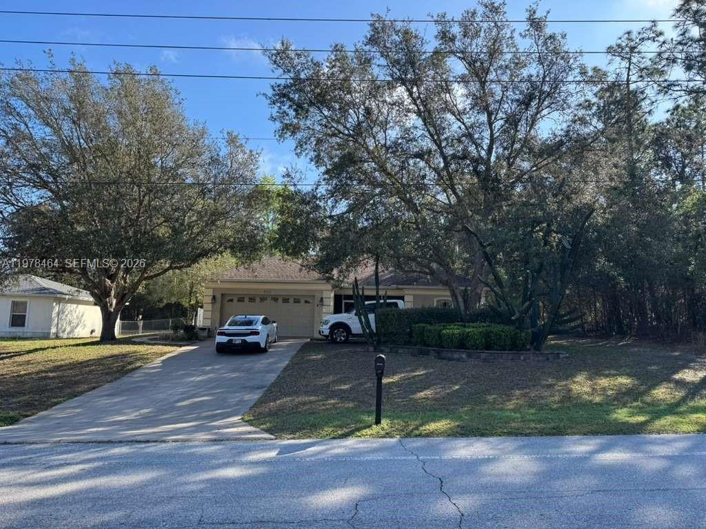 Excellent opportunity in Citrus Springs! Well-maintained 3BD/2BA/2CG home featuring a split-bedroom floor plan, vaulted ceilings, and bright open living spaces. Kitchen with granite countertops, ample cabinet space, pantry storage, and adjoining dining area. Spacious primary suite with tray ceiling, updated bath, large walk-in closet, and roomy shower. Two secondary bedrooms and a full guest bath offer flexibility for family, guests, or office space. Enjoy an indoor laundry room, screened front entry, and a huge enclosed lanai with a convenient kitchenette area, offering versatile space for relaxing, entertaining, hobbies, or fitness. Fenced backyard with storage shed and covered outdoor area. Attractive landscaping and irrigation system. Schedule your showing today!