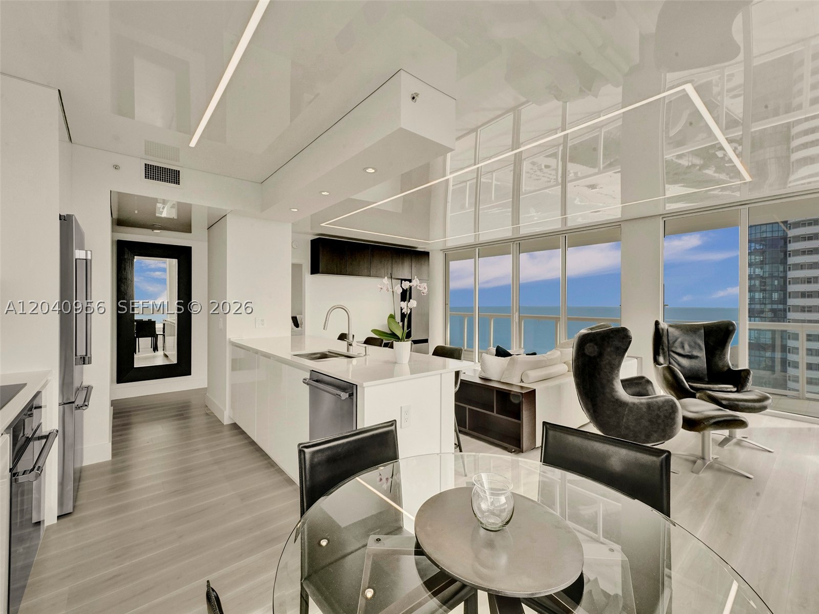 Welcome to this stunning, sun-filled two bedroom and two baths luxury residence located in the heart of Miami Beach. Recently renovated this modern stylish condo offers an ideal retreat for individuals seeking a luxurious beach lifestyle. Oceanfront luxury building with upscale amenities including an oceanfront state-of-the-art fitness center, tennis and pickleball court, game room and beach service. 
The open-concept living space of the unit allows for seamless flow and the gourmet kitchen boasts top-of-the-line Thermador appliances, a wine cooler, sleek cabinetry and ample counter space. The unit features a wrap-around balcony with amazing ocean, intracoastal and city views. Walk to restaurants, shops and everything Miami has to offer. Just minutes away to Bal Harbor, Design District, Wynwood and the Miami International Airport.