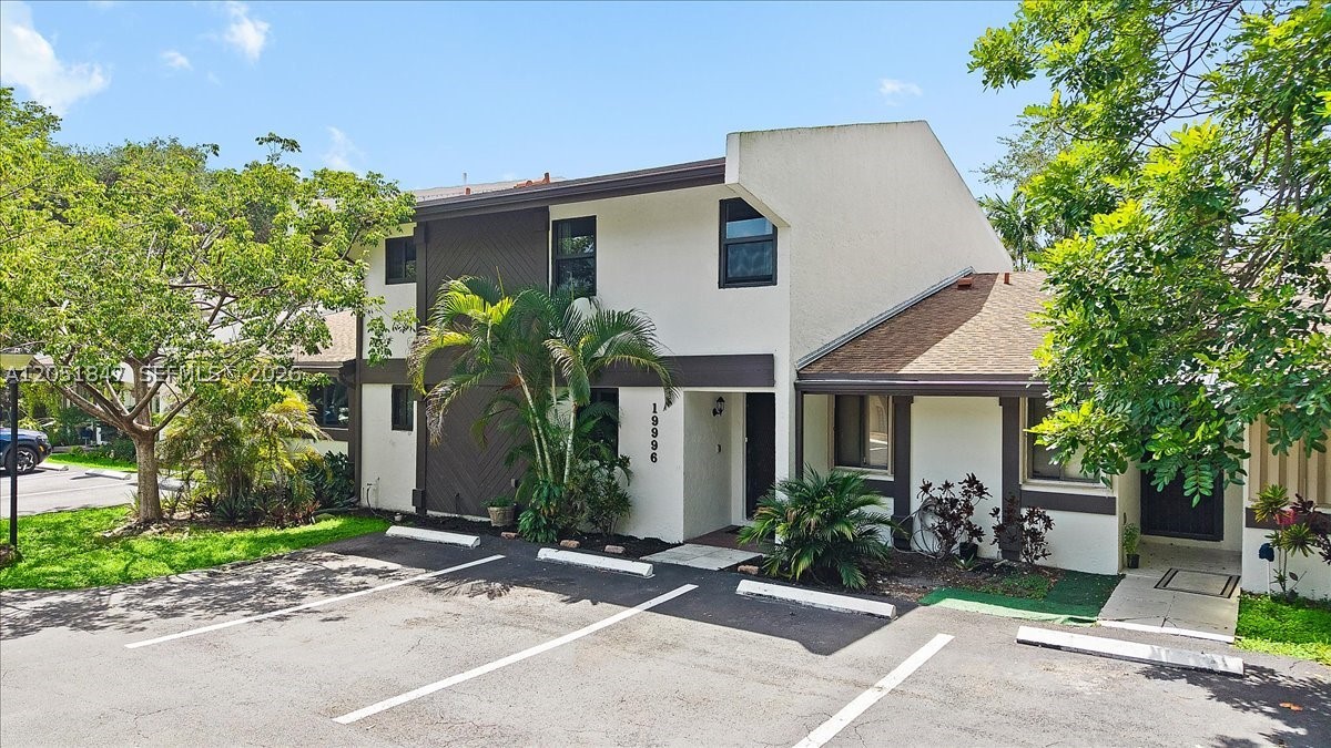 Discover this rare, true 2,000 sq. ft. 2 story townhouse in Sandpiper At The California Club gated community offering space and quiet you won't find in newer builds. Enjoy a bright open layout, brand-new impact windows, Roof and AC replaced in 2022, marble showers and updated faucets, vinyl flooring, and modern ceiling fans — plus stunning west-facing sunset views. Listed as a 2-bedroom, 2 bath in the county records, but actually has 3 full baths and has flexibly been lived in as a 3-bedroom for years. The lower-level features a built-in Murphy bed, wraparound curtains, private patio access and its own full bathroom and vanity — ideal as a guest suite or open-concept living/dining space with the Murphy bed up. Upstairs, soaring vaulted ceilings, and oversized fans create an airy feel rarely found today. The primary suite includes a double door entrance, three closets and a spa-like bath with a 3-person jacuzzi tub and an oversized walk-in shower. The second bedroom offers a large walk-in closet and shower built for two. Outside, enjoy one of the largest backyards in the community, on a quiet, rarely used culdesac. Planet Fitness and Burlington are a short walk away, and the community pool, hot tub, and lakeside pier are just a few minutes walk through the trees from your door perfect for relaxation and inspiration. Live your best life, in a home designed to elevate every day. Escape to Your Private Townhome Retreat.