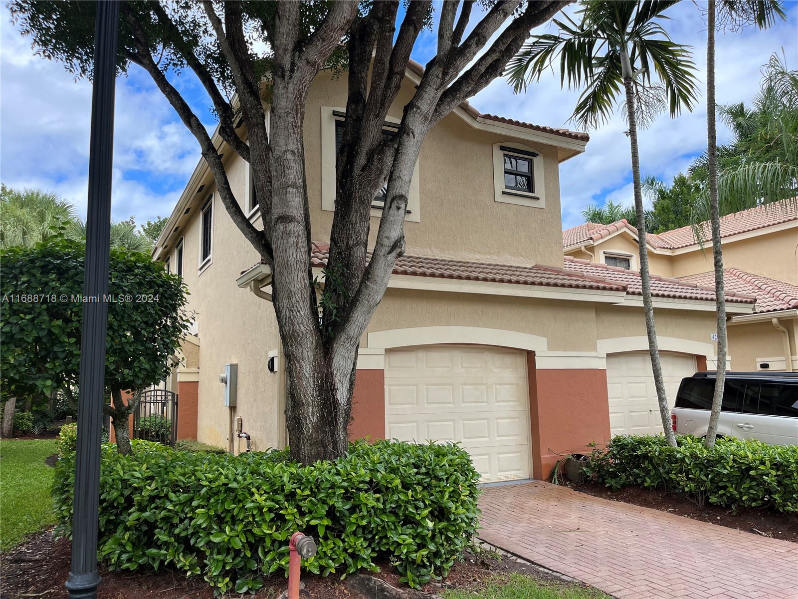 Are you looking for a high level of life quality for you and your family? This is your place to live. Beautiful and spacious 4 bedroom, 2 full bathrooms and additional half guest bath townhouse, totally renovated with laminated floor, new tile with and an incredible intimate patio to enjoy in family. Located in the desirable Couyartd at the Grove development, walking distance of the best schools in town on Weston, one of the most securities cities in Florida.