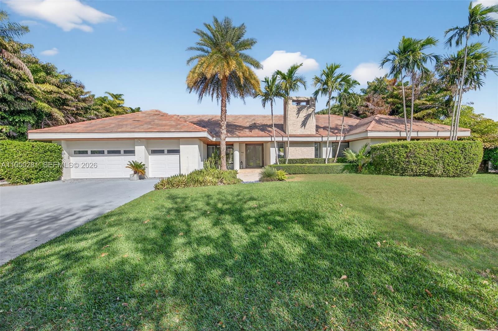 Set on a lush corner lot within a quiet Pinecrest cul-de-sac, this 5-bedroom, 4-bath residence offers the kind of space, privacy, and flow that’s increasingly hard to find. Vaulted ceilings and abundant natural light create an airy feel throughout the main living areas, all oriented toward the backyard for seamless indoor-outdoor living.
The kitchen is the true heart of the home — generously sized, beautifully appointed, and designed to anchor everyday life as well as entertaining. From here, the layout opens effortlessly into the living and dining spaces, with pool views and a striking fireplace adding warmth and character.
The primary suite enjoys direct views of the pool and backyard, along with a spa-inspired bathroom that feels both calming and refined. Impact windows and doors throughout, a covered patio, and a resort-style pool with waterfall enhance comfort, security, and year-round enjoyment.
Thoughtfully located in the heart of Pinecrest, this home offers easy access to major roadways, top-rated A+ schools, parks, and everyday conveniences — all while maintaining a sense of privacy and retreat. A well-balanced home where design, location, and livability come together.