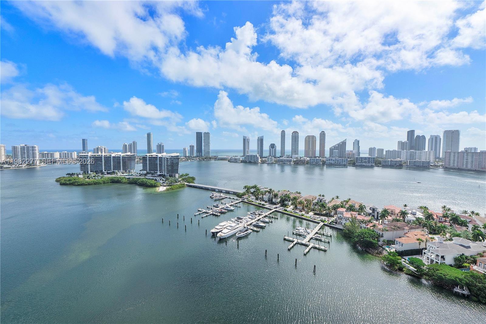 Residence 2609 at 7000 Island Blvd in prestigious Williams Island offers approximately 2,730 SF of spacious waterfront living with stunning views of the Intracoastal Waterway, Atlantic Ocean, and the Sunny Isles skyline. This expansive tastefully modified floor plan 3 bedroom, 2.5-bath flow-through residence features bright open living and dining areas, sleek white porcelain floors, floor-to-ceiling glass doors, and an oversized balcony ideal for enjoying panoramic water views and ocean breezes. The split floor plan provides privacy for all bedrooms, while the generous primary suite offers balcony access, serene water views, and ample closet space. Located in the sought-after 7000 Building with a renovated lobby, new fitness center, business center, and card and game rooms, plus one of the lowest HOA fees on Williams Island. Williams Island is a gated luxury waterfront community offering 15 tennis courts, 4 pickleball courts, marina, spa and fitness center, multiple restaurants, Starbucks, dog park, scenic walking paths, courtesy shuttle, and 24-hour security. Resort-style living in the heart of Aventura, minutes to beaches, Aventura Mall, and fine dining.