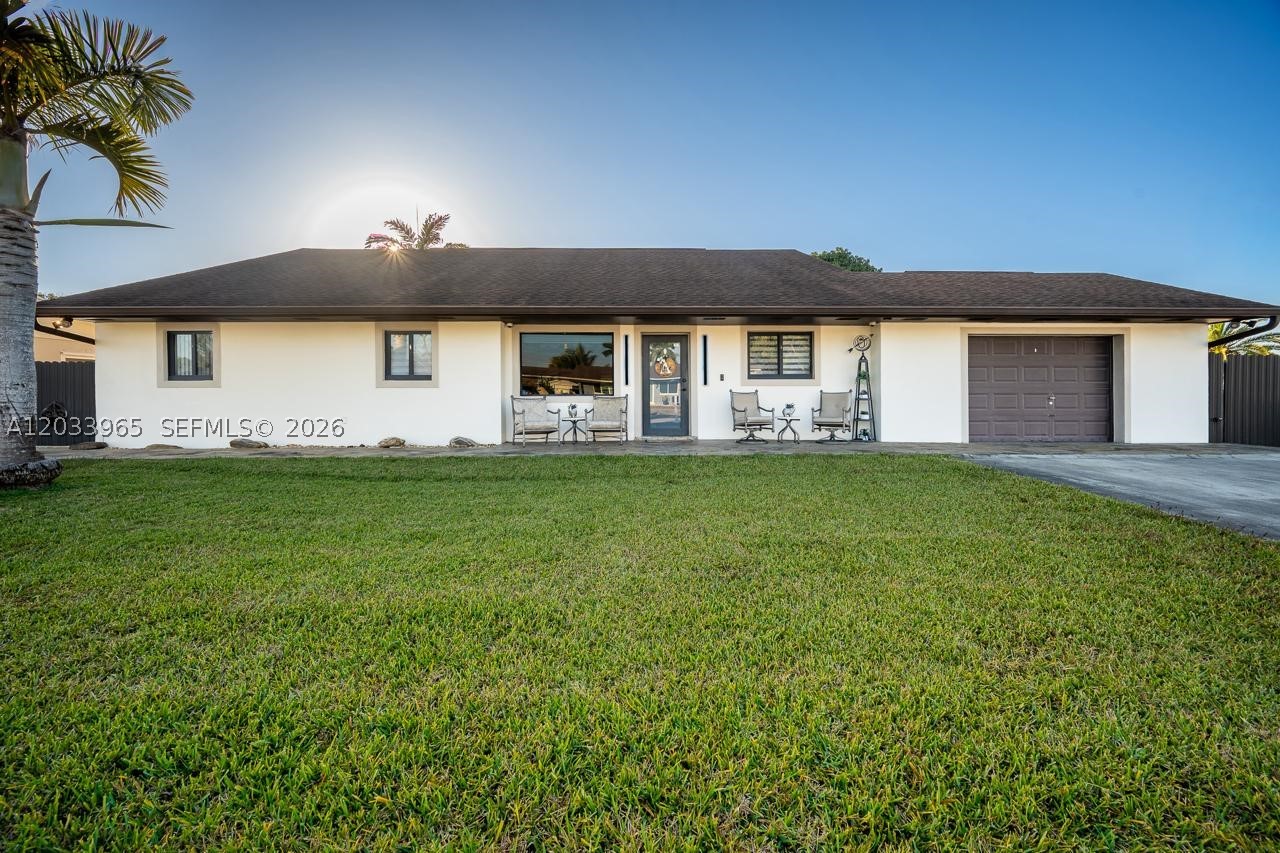 Price Improved! Rare corner-lot opportunity in the heart of Homestead with no HOA and room for all your toys.
Seller willing to contribute toward buyer’s closing costs—ask for details. Step inside to a warm, welcoming interior
highlighted by a unique wood ceiling and an open layout that flows seamlessly into a spacious family room—ideal
for everyday living and entertaining. The kitchen sits at the center of it all, offering generous counter space and
easy connectivity to the main living areas. Outside is where this property truly stands out. Enjoy your own private
tropical retreat with mature landscaping, fruit trees, and a custom tiki hut—perfect for gatherings, relaxing
weekends, or creating your own backyard oasis. The home features a remodeled primary bathroom, a large
primary closet, a dedicated laundry room, and several impact windows and doors for added value and peace of
mind. There is ample space for an RV, boat, trailer, or multiple vehicles, plus a newer storage shed for added
convenience. Conveniently located with easy access to major roadways and just a short drive to the Florida Keys,
offering the perfect balance between everyday living and weekend escapes. Furniture available for purchase for a
smooth, move-in-ready transition. Homes with this level of outdoor space, flexibility, and incentives rarely come
available—schedule your showing and experience it in person.