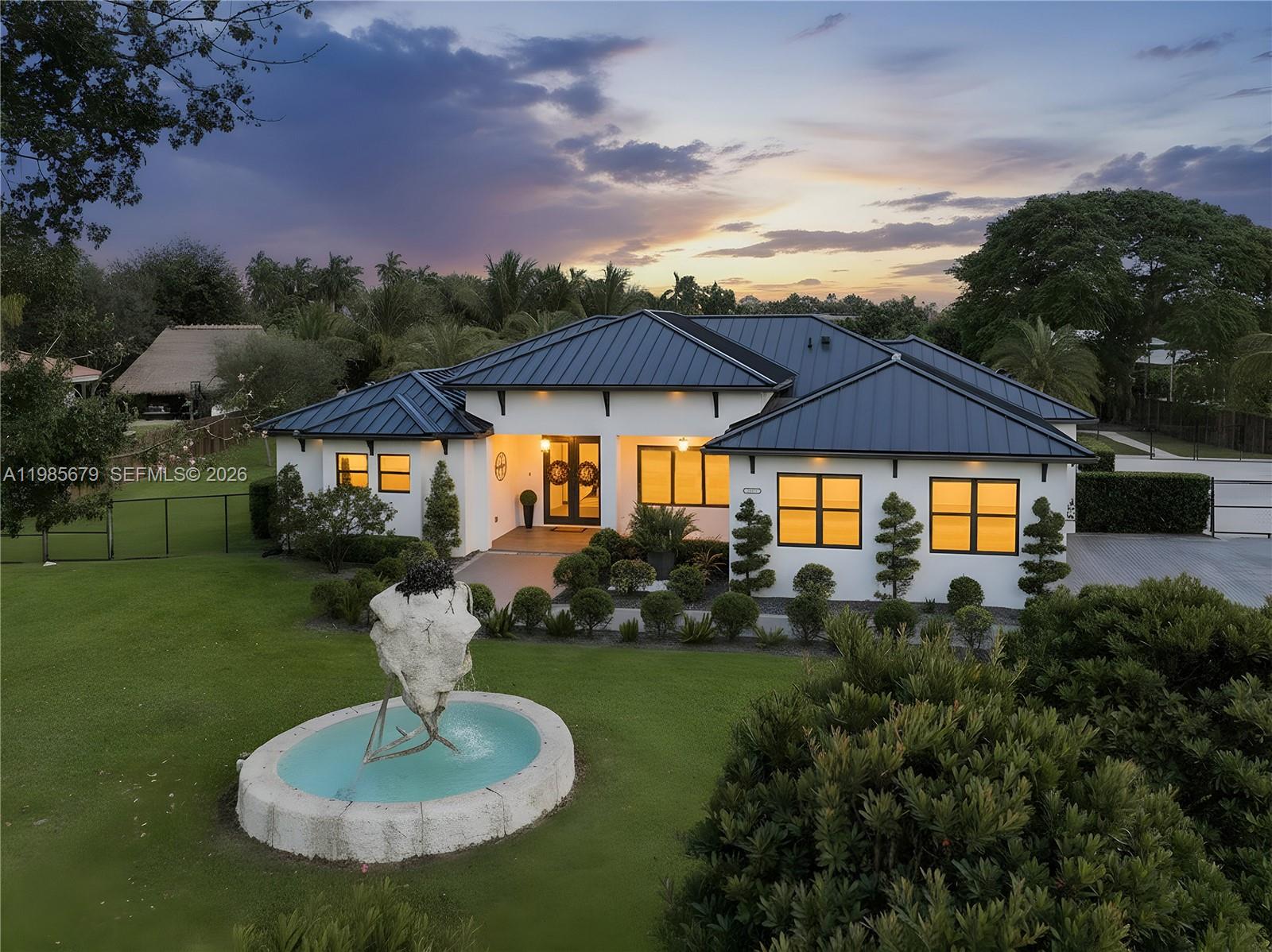 Experience luxury living in this stunning 5-bedroom, 4-bath estate situated on a private 1.25-acre cul-de-sac lot in the exclusive McMinn Estates community. Designed with elegance and comfort in mind, this home features 10-foot ceilings, porcelain tile flooring throughout, impact windows and doors, a durable metal roof, dual HVAC systems, and smart home technology. The gourmet kitchen is a chef’s dream, complete with quartz countertops, custom wood cabinetry, and premium stainless steel appliances. Step outside to your private outdoor oasis featuring a spacious 30×30 pergola with LED lighting and a fully equipped Paradise Grill Maui-style outdoor kitchen with Avellaero stone countertops perfect for entertaining. A serene koi pond with a fountain creates a welcoming entrance, adding to the home’s peaceful ambiance. Enjoy privacy, space, and freedom with no HOA. Don’t miss the immersive 3D virtual tour. Schedule your private showing today! May the Force be with you!