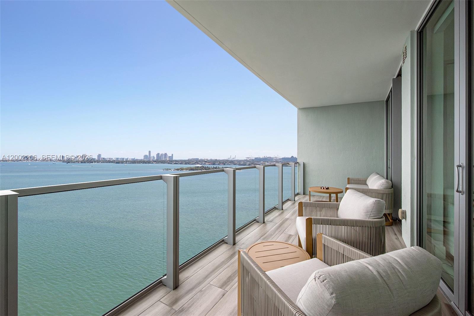 This expansive 2 Bed / 3 Bath + Den unit, offers unobstructed bay views with breathtaking sunrise and moonrise. Located in the desirable 05 line, this unit features a unique flexible second bedroom with a tempered glass movable wall—open it up for a spacious layout or enclose it for privacy. Private foyer entrance ensures a quiet, exclusive feel. Equipped with Miele appliances and modern finishes. Situated in Edgewater Miami, just 2 blocks from Whole Foods Market and minutes to Brickell, Wynwood, and the Design District. A top building in the area, currently undergoing renovations—own in what will soon feel like a brand-new luxury tower.