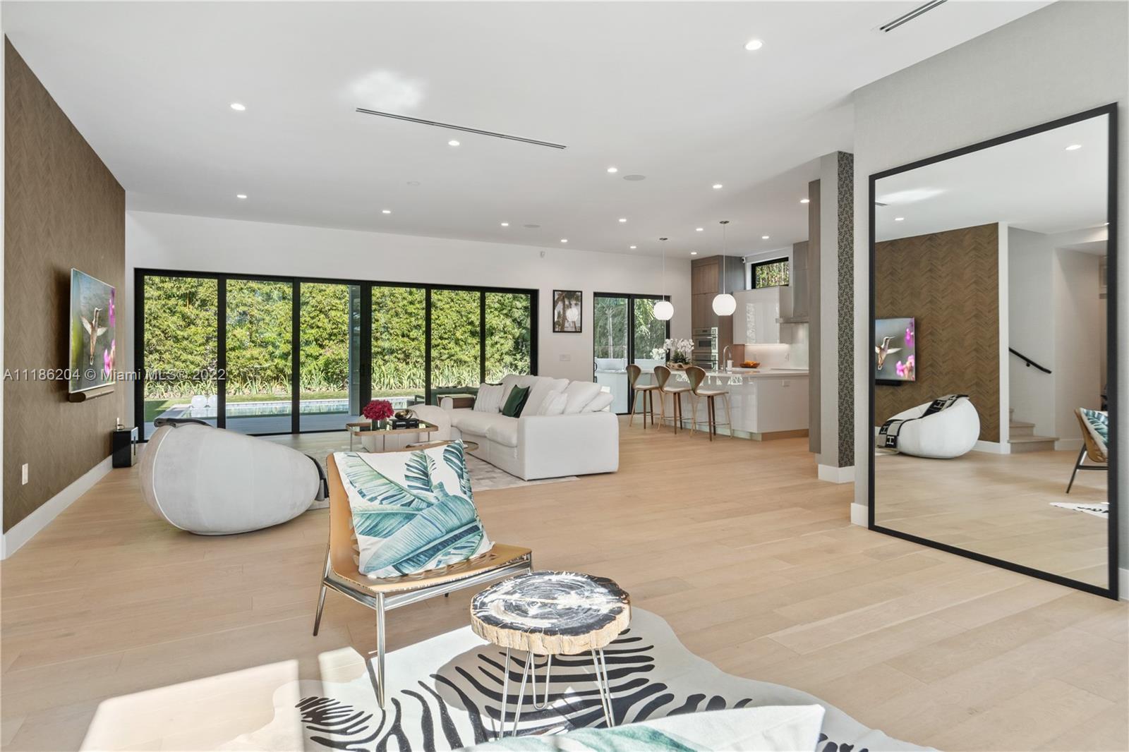 This beautiful new construction was built in 2020, offering 5 bedrooms, and 3,859 SF of living area. The 2- story home provides for an open floor plan and lots of natural light. Additional features are wood floors, a modern open kitchen with kitchen island, modern bathrooms, spacious his-and-hers walk-in closets and a large terrace on the first floor overlooking the pool. The 10,000 Sf lot offers a covered terrace with summer kitchen, a pool and lost of privacy because of its lush vegetation. The property offers a 1-car garage and a carport.