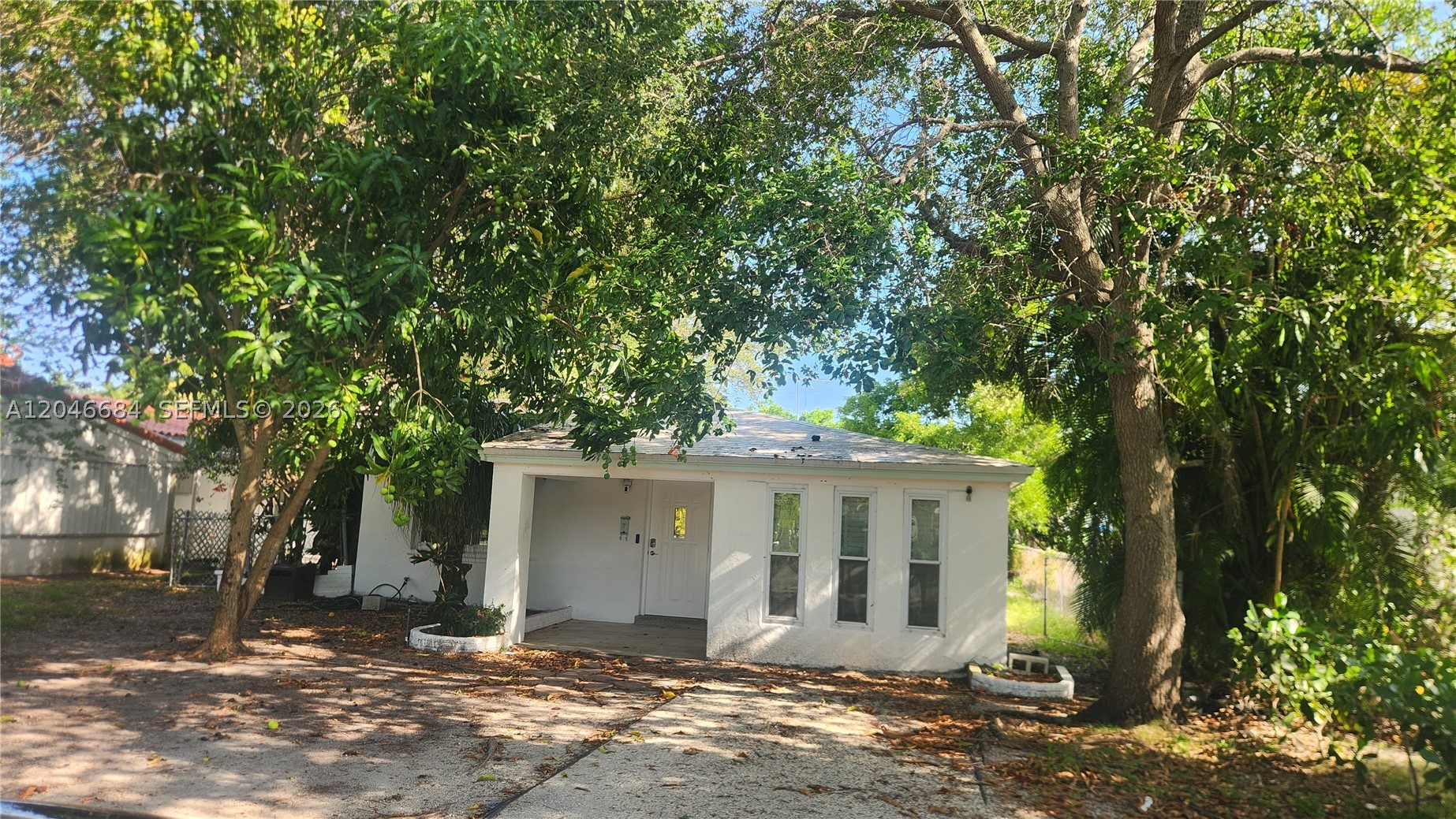 NO HOA! Updated Home with ASSUMABLE VA LOAN at 3.75% (for those VA who qualify)— Perfect for End-Users or Developers!   -  This well-maintained single-story residence is move-in ready, featuring several key updates. The home offers 3 bedrooms and 2 updated bathrooms. Two of the bedrooms are interconnected internally and share one of the bathrooms. A third bedroom. The interior includes a living-dining area and a spacious family room with ample square footage for a den or home office. The kitchen has been completely updated, and both bathrooms have been fully remodeled. Outside, you will find an exterior laundry room, a spacious backyard, and a large front driveway with plenty of parking space for multiple vehicles. A major benefit of this property is that it features complete impact windows and doors throughout.  GREAT FINANCING OPPORTUNITY: ASSUMABLE VA LOAN: Property features an assumable VA loan of approx. $257,000 at 3.75% interest rate. Assumption is strictly subject to lender approval and requires a full Substitution of Entitlement by a qualified Veteran buyer so that Seller’s VA entitlement is fully released at closing. No exceptions!.  With NO HOA, this property is also an excellent opportunity for developers or anyone looking for a prime location to build their dream home. It is conveniently located close to parks, major access roads, local restaurants, and shops.