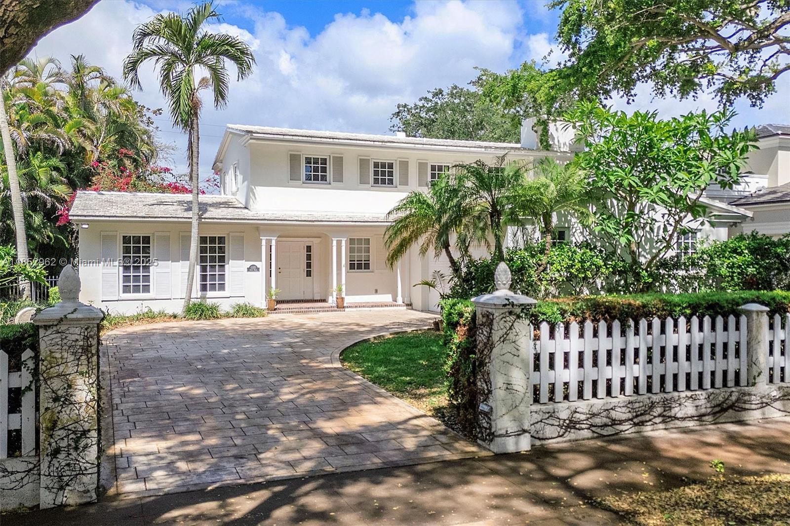 Experience luxury living in this distinctive Florida Tropical home designed by architect Walter S. Klements. Nestled within the historic Pioneer Village, a jewel in George Merrick's "City Beautiful" vision, this residence offers unmatched sophistication. Panoramic Riviera Golf Course views through oversized windows illuminate four bedrooms, four bathrooms, a large open kitchen, a spacious living room, and an expansive family room, perfectly blending historic charm with modern convenience. Indulge in resort living with a sparkling pool offering direct green access and a two-car garage. Now the lowest-priced home on prestigious Santa Maria Street, this architectural masterpiece awaits discerning buyers. A rare opportunity to own large-scale luxury in this highly coveted location!