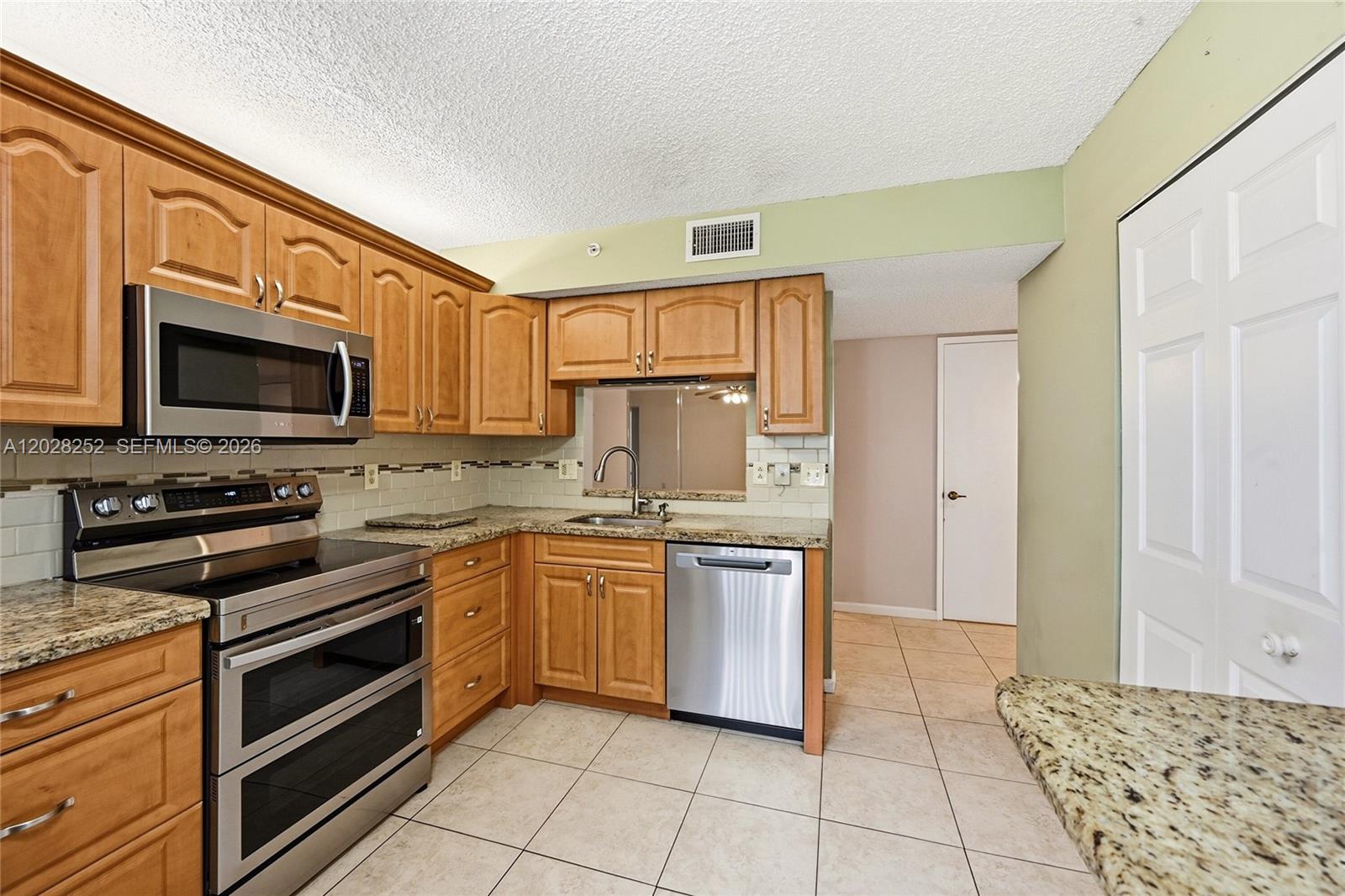 Truly in excellent condition, this move in ready 2 bedroom, 2 bathroom first floor residence is located in a gated active adult community in the heart of Delray Beach. Enjoy a bright and spacious layout with granite countertops, stainless steel appliances, hurricane protection (Accordion shutters & impact sliders, and a huge laundry room for extra convenience. Perfect as a full time residence or winter home, this property offers comfort, convenience, and the South Florida lifestyle you have been looking for. Don't miss this one!