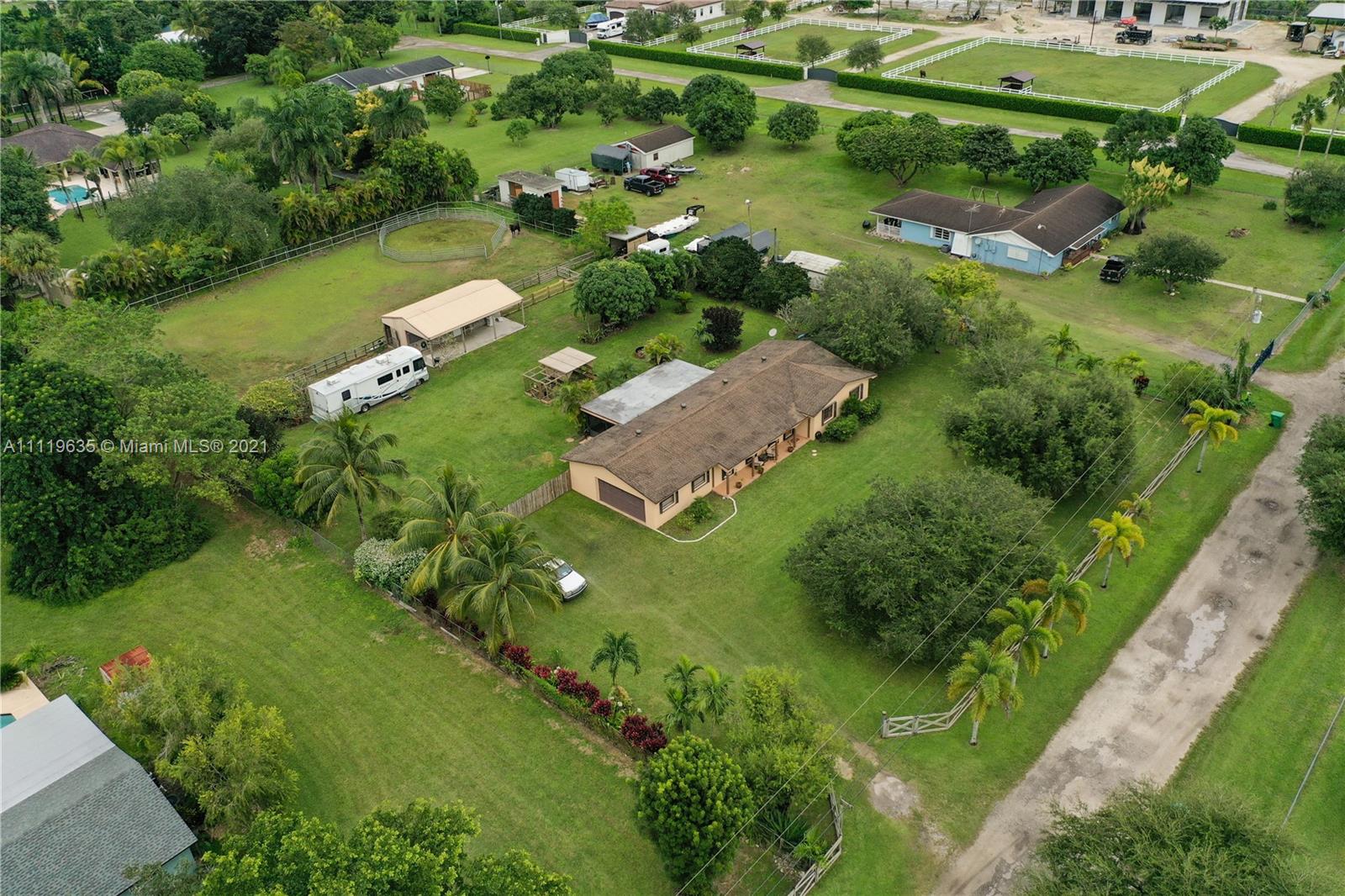 Equestrian facility triple fenced yard (front, middle and back yard).  Barn with center tack room and 2 stalls that are 12x12 each. There is an additional separate stall that is also 12x12, all stalls have run-outs. 3/2 Ranch home, 2 car garage and screened patio. Separate 110 hook-up for RV, accordion shutters, surround sound in living area, assorted fruit trees. Please only prequalified buyers.