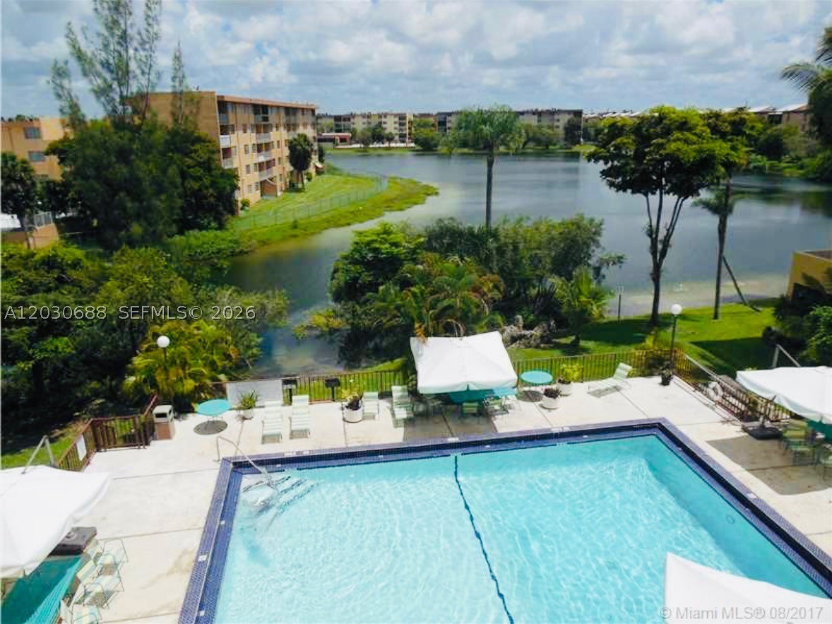 Corner 2-bedroom, 2-bathroom unit with water views from every room. Bright and well-maintained, featuring Mexican tile flooring throughout with no carpet, custom closets, multiple storage closets, updated electrical panel, new ductwork, accordion shutters on the balcony, new bathroom mirrors, and an updated vanity. Assigned parking. A/C is approximately 10 years old. All current assessments have been paid in full. Excellent location near major highways, shopping, dining, schools, and Miami International Airport. Easy to show!