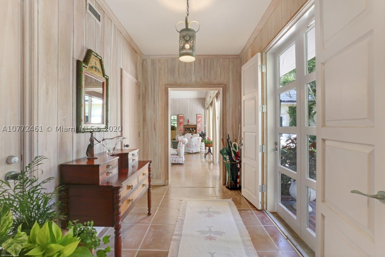 Be amazed at the tropical beauty of the 2.5+/- acre estate comprised of two deep parcels that provide ocean access with 131+/- feet of private beachfront and just enough riverfront to enjoy spectacular Florida sunsets reflecting off the Intracoastal.  Its charming courtyard entry invites visitors in with a warm welcome. The classic Bermuda-style main house includes 3-bedrooms, 5.5-baths exuding understated elegance that is found throughout Jupiter Island. Treasured cypress walls and terracotta tile floors are featured in the main living areas with parquet flooring in the formal dining room and bedrooms. Step outside to the delightful covered lanai and terrace with pool nearby, all overlooking the vast lawn and riverfront.  The property also includes a very private separate guesthouse.