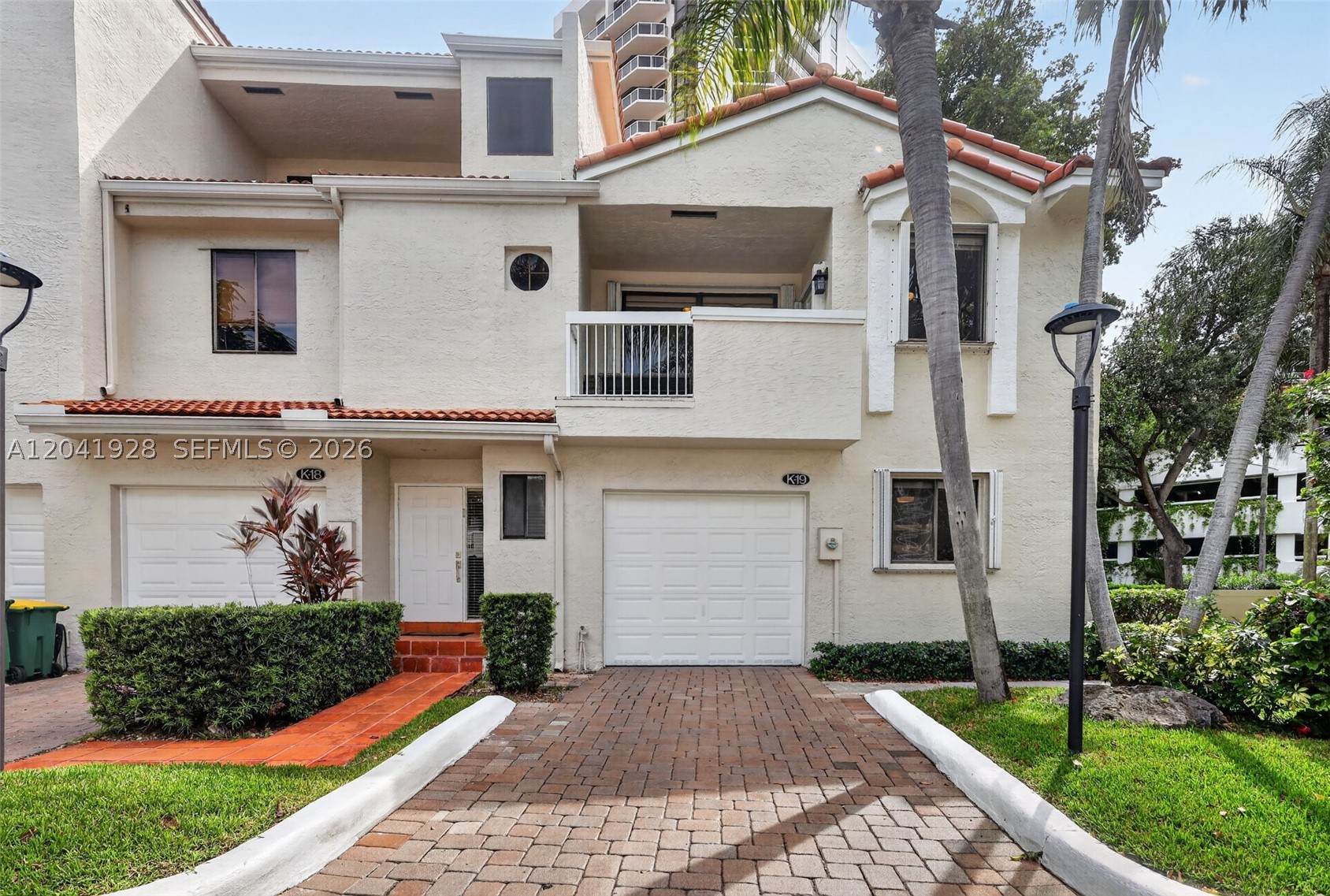 Come experience this beautifully updated private end-unit home where thoughtful design meets South Florida sunshine. This unique southeast facing residence is filled with direct natural light from sunrise to sunset year-round. The open-concept kitchen features new LG smart appliances, customizable smart lighting, and flows seamlessly into the living areas ideal for entertaining and everyday living. Wake facing the sunrise in the primary suite, featuring vaulted ceilings, a custom work nook, spacious walk-in closet, and private balcony. The second and third bedrooms enjoy a sunset facing balcony, while a skylight above the staircase enhances the home's bright, indoor-outdoor ambiance. The first floor bedroom includes a custom built-in bookcase with accent-lighting, making it perfect as a home office. Exceptional storage includes a large, fully finished, air-conditioned storage loft, two overhead garage storage systems, under stair storage, oversized closets with double shelving, and a second-floor laundry area with full size LG washer and dryer. Major upgrades offer peace of mind: four year old roof,  two year old oversized oversized  A/C , and three year old water heater replacement plus shutter servicing . Enjoy distant views of the Diplomat and Hallandale Beach skyline plus extra space outside the front entrance. All within a well-managed community offering one of Aventura's lowest HOA costs per square foot. Schedule your private tour today!