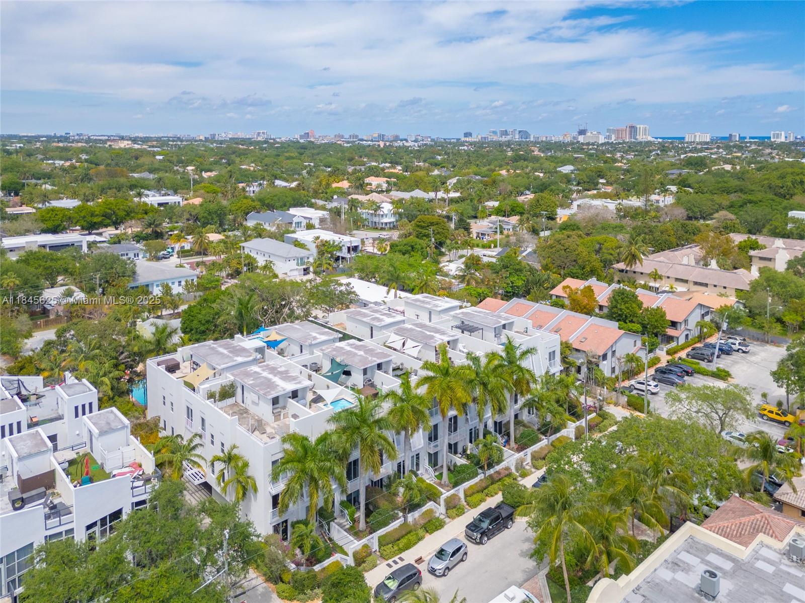 Fully renovated tri level townhome located in the heart of Rio Vista. This 3 bedroom 3.5 bath residence offers over 2,100 square feet of modern living space with a private elevator, built-in surround sound, and a two car garage with EV charging. The rooftop terrace is the showstopper, featuring a full summer kitchen, hot tub, and panoramic city views. Inside, enjoy a chef’s kitchen with quartz countertops and stainless steel appliances, spa inspired bathrooms, and custom closets throughout. A turnkey urban retreat just minutes from Las Olas and downtown Fort Lauderdale.