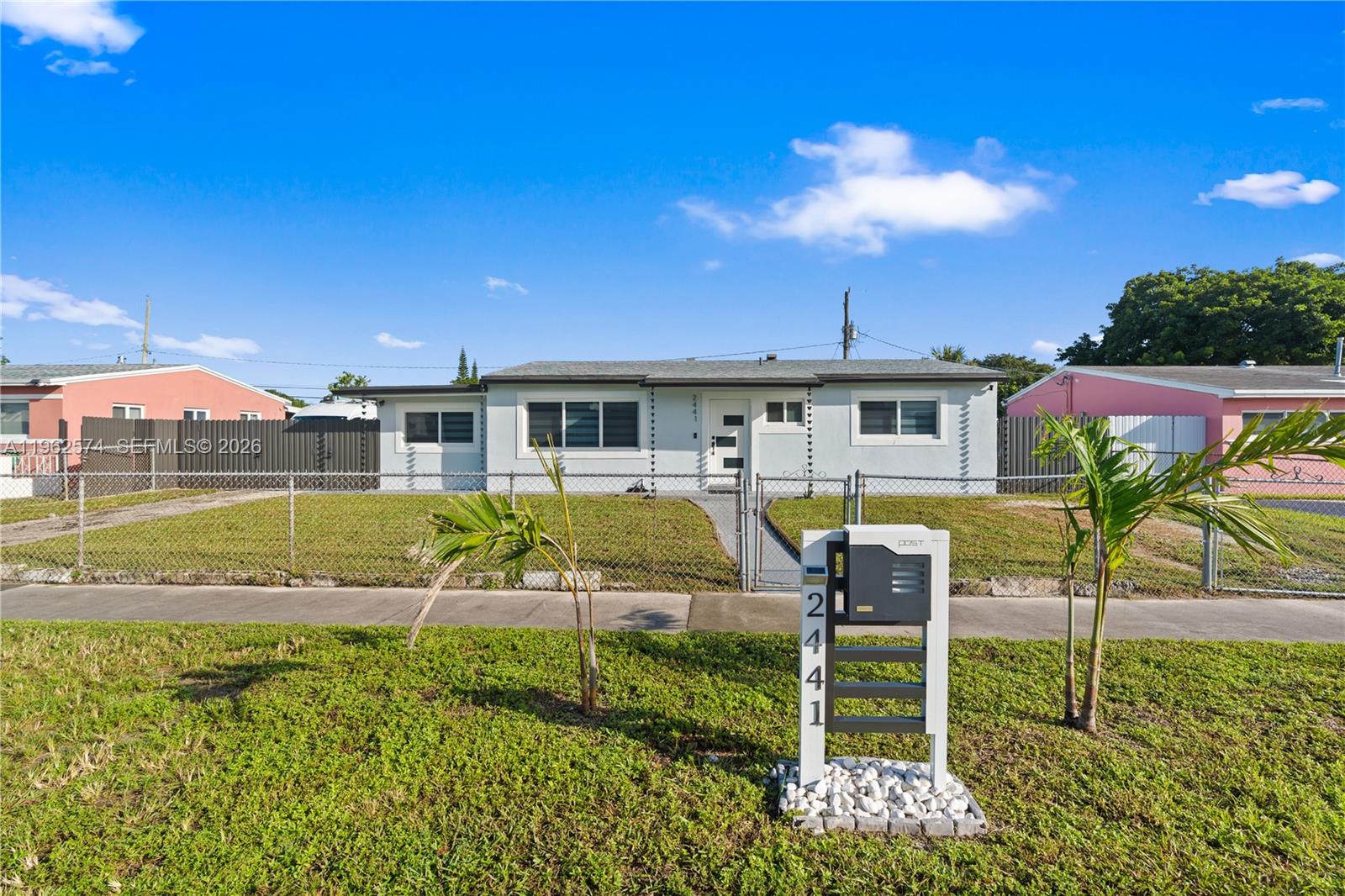 100% financing available! Gorgeous home! Recently upgraded from top to bottom in excellent and growing area near Hard Rock stadium! New Ac, Impact doors and windows throughout, 3-year-old roof, upgraded kitchen with stainless steel appliances, tankless water heater, zebra blinds, high quality vinyl flooring, upgraded bathrooms, scenic lighting, new exterior fence and pergola, upgraded electrical system, ample patio area with room for a pool and adding sq ft to property, shed outfitted with ac mini split unit you can also use as a dog house, natural gas line, plenty of parking spaces and more! Located close to Hard Rock stadium, major highways for easy commuting, restaurants, shopping and schools. A must see!