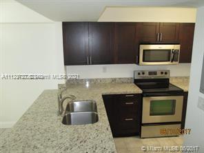 First floor unit!! One of the best condo in the complex. Beautiful 2 beds / 2 baths, very spacious almost 1200 square feet. Fully remodeled, this corner condo has an open concept with gourmet kitchen, stainless steel appliances, granite counter tops and a pantry. Two balconies, upgraded baths, full size washer & dryer, plenty of closets. Tile floors in common areas and Berber carpet in bedrooms. Smooth ceiling (no popcorn). Split floor plan. Pool alongside the lake, clubhouse, gym, tennis, children's playground, large BBQ area for picnicking, extensive winding walkway all along water's edge. Don't miss this opportunity! Very close to Black Point Marina. Gated community plenty of visitor's parking. Three months to move in is a must. No pets allowed.