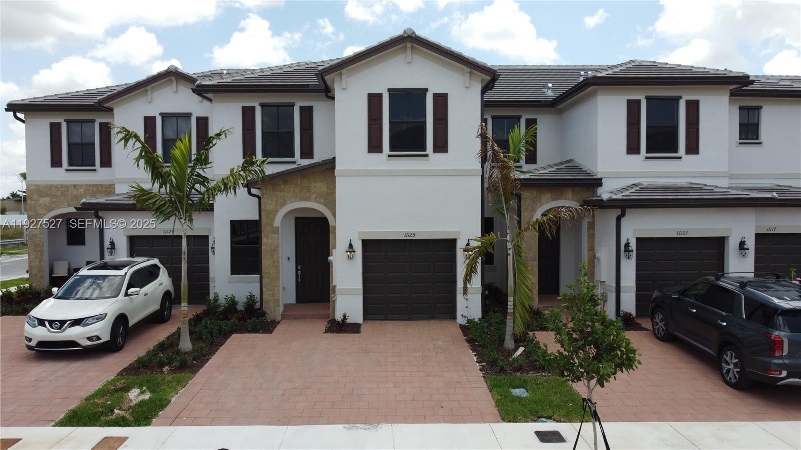 A stunning townhouse located in the Aquabella Community. This freshly painted home features 4 bedrooms, 2.5 baths, a beautifully designed open kitchen that flows into the dining room, a one-car garage, an oversized driveway with ample space for two additional cars, and a charming backyard. The property showcases exquisite finishes, and its prime location offers convenient access to major highways such as the Turnpike, Palmetto, and I-75, as well as supermarkets, gas stations, shopping centers, Walmart, and more. Don’t miss the opportunity to make this your dream home!