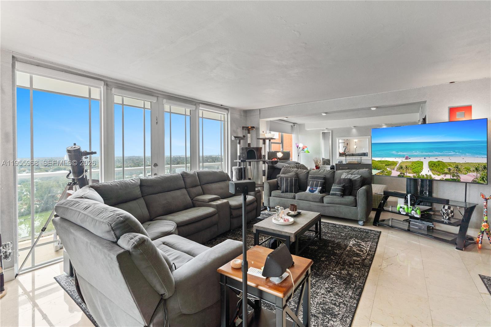 A modern, spacious, and luxurious penthouse 2 bedroom and 2 bathroom is one of eight highly coveted residences featuring a wrap around balcony with breathtaking views of Downtown Miami, Sunny Isles, and Hallandale. This residence includes a deeded covered parking space. The living room and primary bedroom feature high-impact sliding glass doors opening to an expansive glass-railed balcony, flooding the space with natural light. Gorgeous marble floors throughout complement the hardwood flooring in the primary bedroom. Located in a highly desirable area, the property offers convenient access to the Brightline train station, Fort Lauderdale–Hollywood and Miami International Airports, and major highways. Aventura Mall is just minutes away.