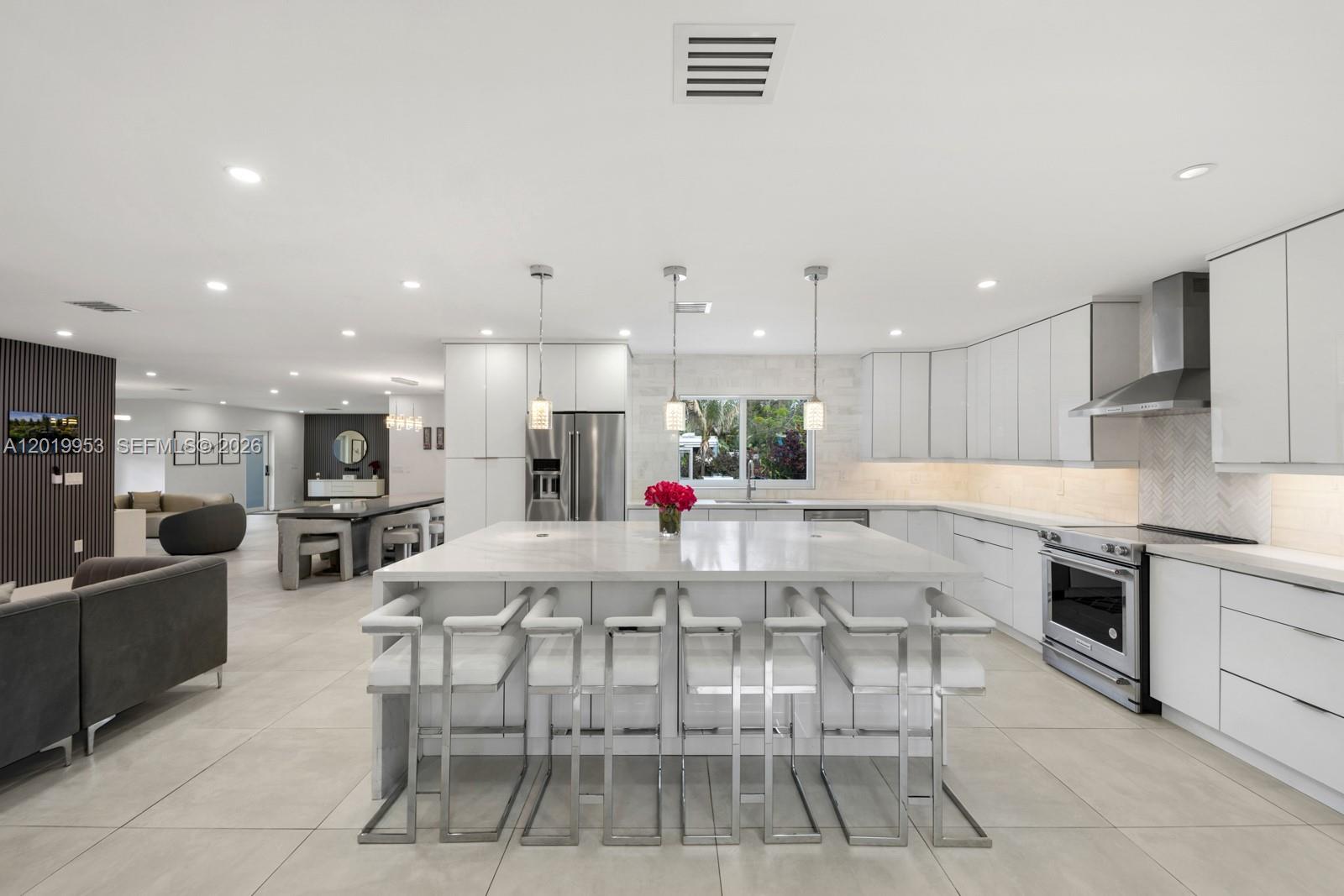 Fully remodeled 5BD/3BA estate situated on over half an acre with 3,418 sq ft and over $400K in renovations! This stunning fully solar-powered home features an incredible backyard oasis complete with a pool, spa, koi waterfall pond, playground, outdoor kitchen, and ultimate privacy. Spacious open living areas, modern upgrades throughout, and an expansive 500 sq ft outdoor space make this the perfect family home or private retreat. Rare opportunity in a prime Pompano Beach location just 10 minutes from the beach and walking distance to Kester Park!