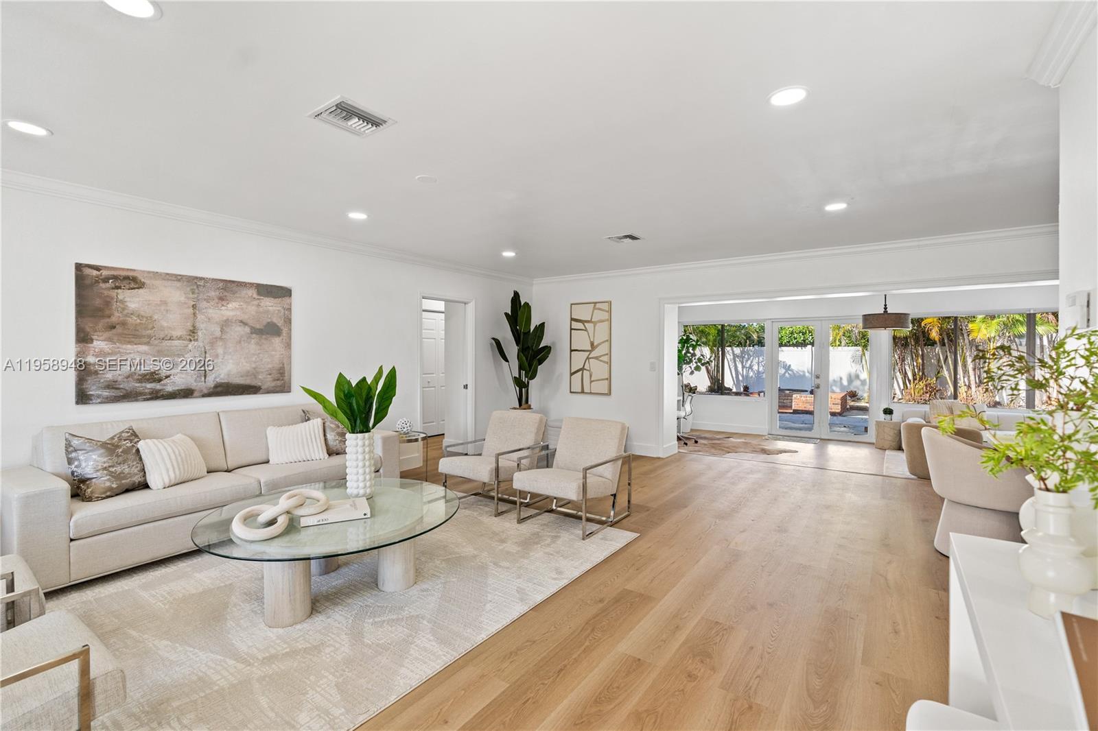 Price improved on this great corner home! Coastal living meets comfort in this renovated single-family home in the sought-after Coral Ridge Country Club Estates. Nestled on an oversized corner lot of over 1/4 acre, this 3bed/3bath home is perfect for everyone.A sun-filled, open floor plan and spacious divided back yard, is perfect for entertaining. This unicorn property is a lovely three -block stroll from restaurants, shopping, entertainment, or groceries. It's expansive living area with grand picture windows overlooks your own private paradise. French doors lead out to a fire pit for cozy nights, next around the patio to a lovely, in-ground saltwater pool with its own full  bath and plenty of privacy. For your furry or feathered friends, there is a separately fenced enclosure. The main bedroom overlooks the pool area and comes complete with ensuite double sink vanity and large walk in shower. The split floor plan of the home features 2 additional, sunlit bedrooms separated by a bathroom featuring a jacuzzi tub-shower combination. The chef's kitchen sports a built in wine refrigerator and red wine rack as well as a cozy breakfast nook.  Off the nook is an oversized 2 car garage under A/C. Great for home gym, workshop or house 2 cars plus a golf cart. This lovely home has brand-new impact windows, white tile roof, updated PVC plumbing ,updated electrical, new LVP flooring and paint. Completing this gem is a circular/stacked driveway.