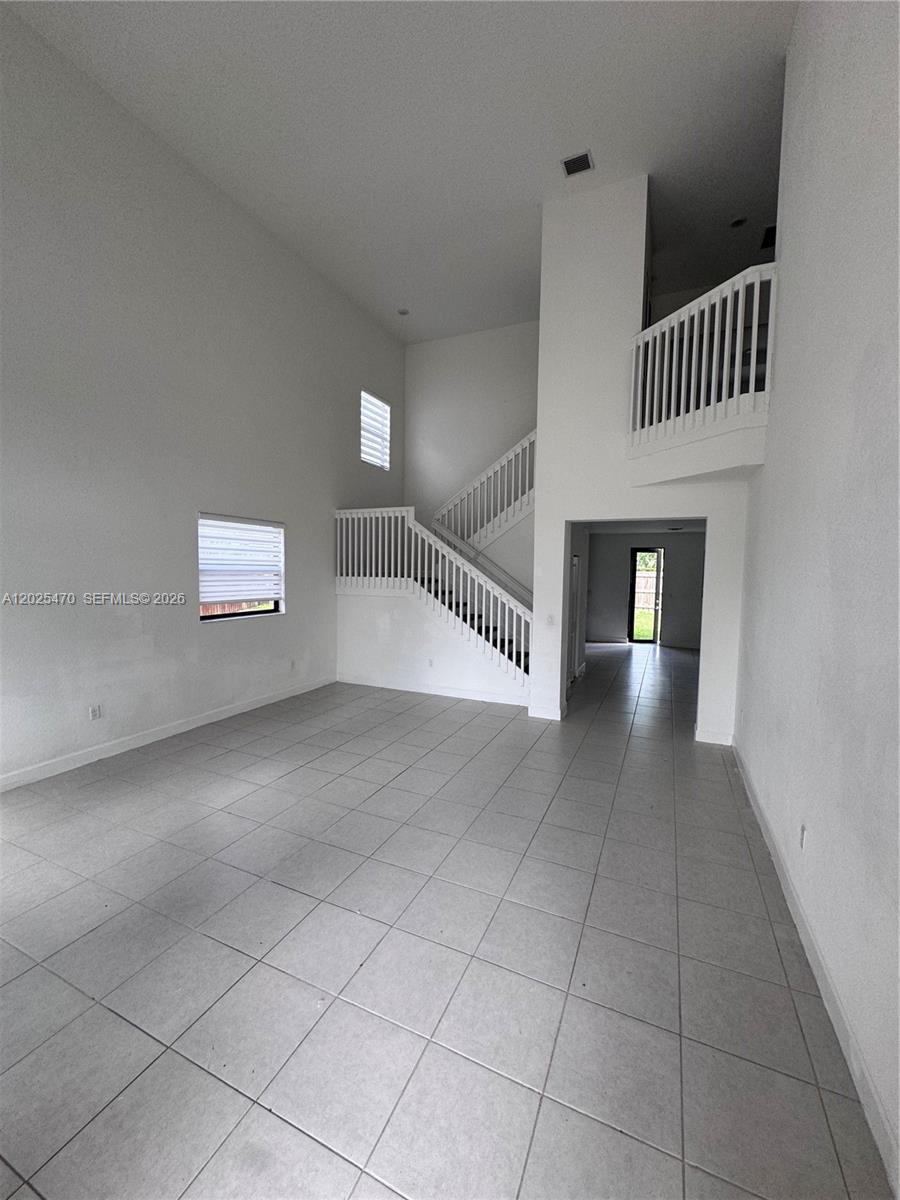**Spacious single-family rental home** located in the **gated Capri community by Lennar in Homestead**. This fairly new residence offers **4 bedrooms and 3 bathrooms**, with **2,878 sq ft of living space** and an open, airy floor plan. Biggest model inside this community and extra lot space on the back area. One bedroom and bathroom downstairs. Features include a **large open kitchen**, expansive living and dining areas, and a **very large backyard** ideal for outdoor enjoyment. Conveniently located **near shopping, schools, dining, and major highways**. A great opportunity to lease a modern home in a secure, well-maintained community.